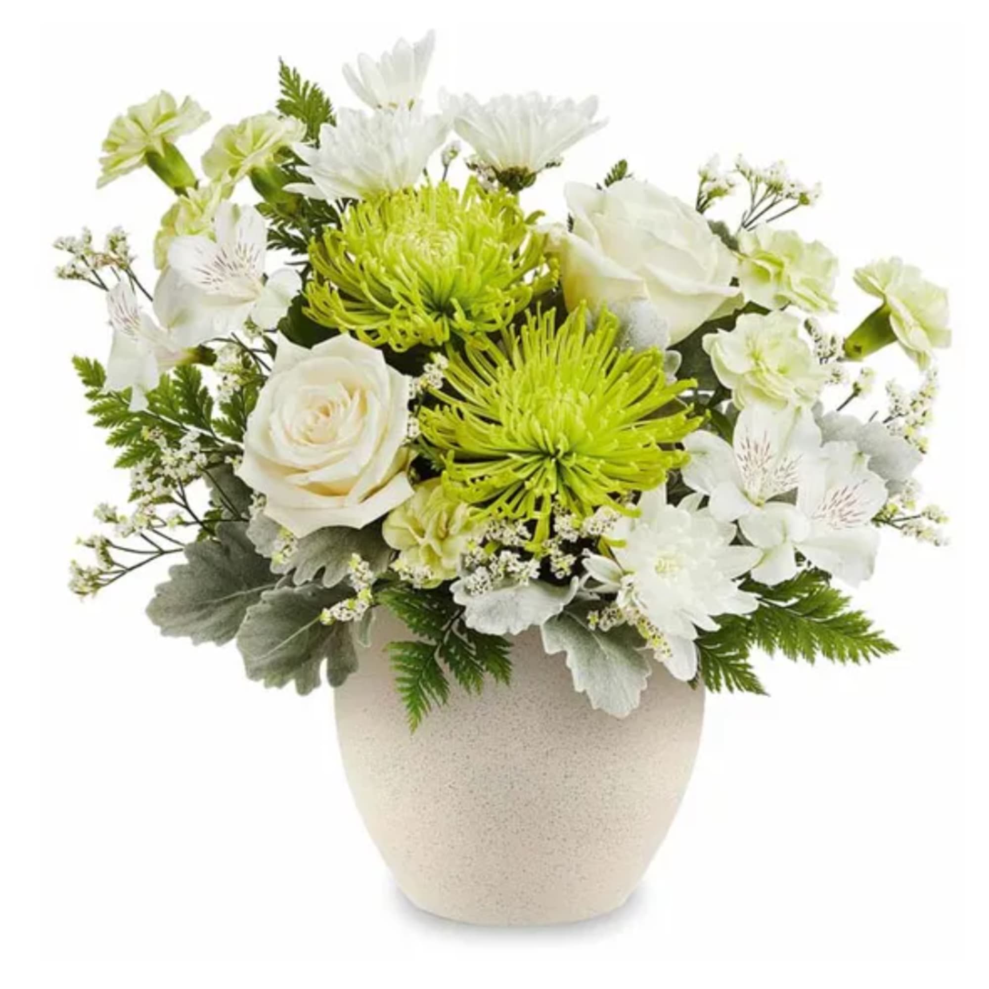 White and green floral arrangement in a beige vase