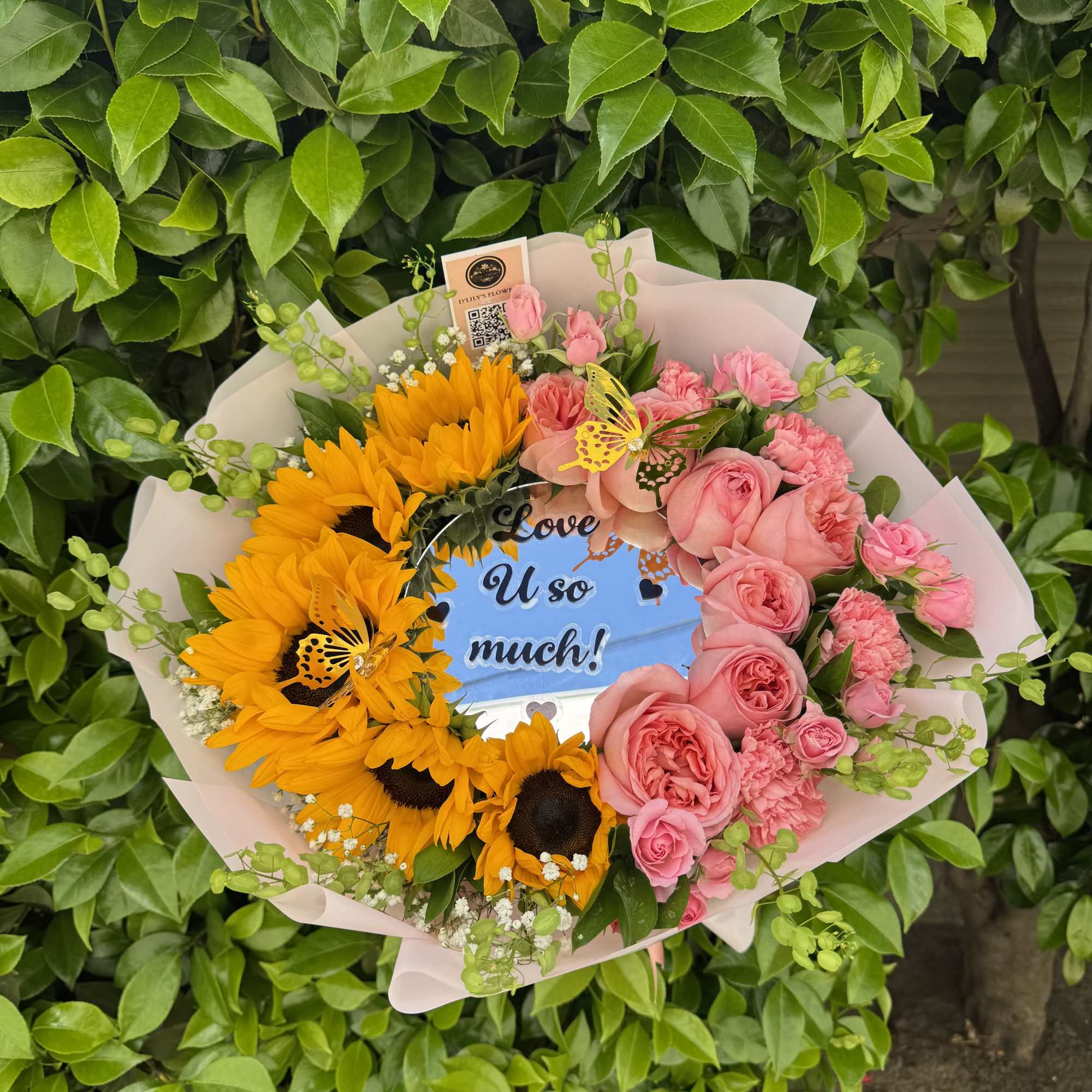 A sweet mix of sunny blooms and soft pink petals, made to