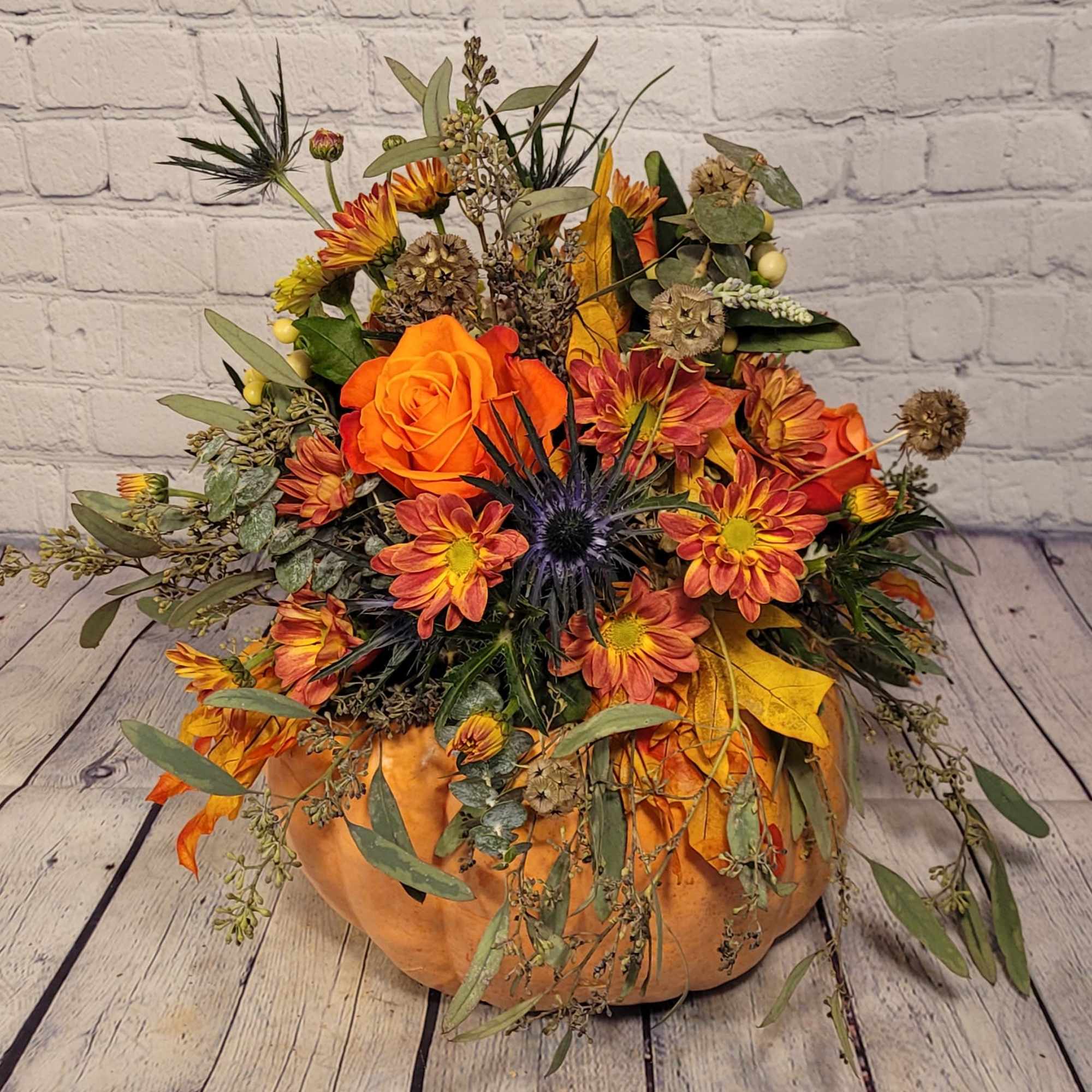 This bouquet of flowers is arranged on top of a real locally
