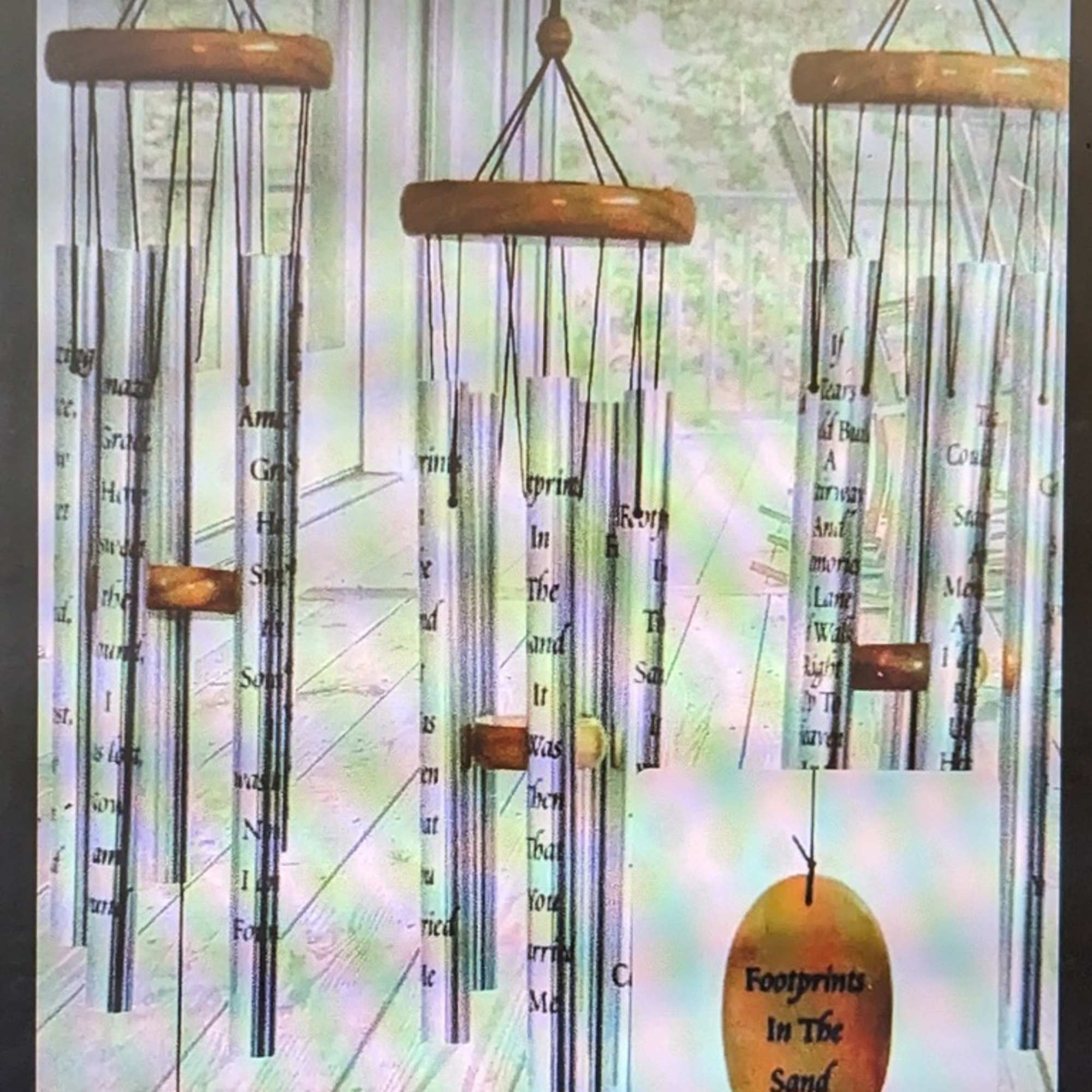 Hanging metal wind chimes with wooden tops and printed tubes