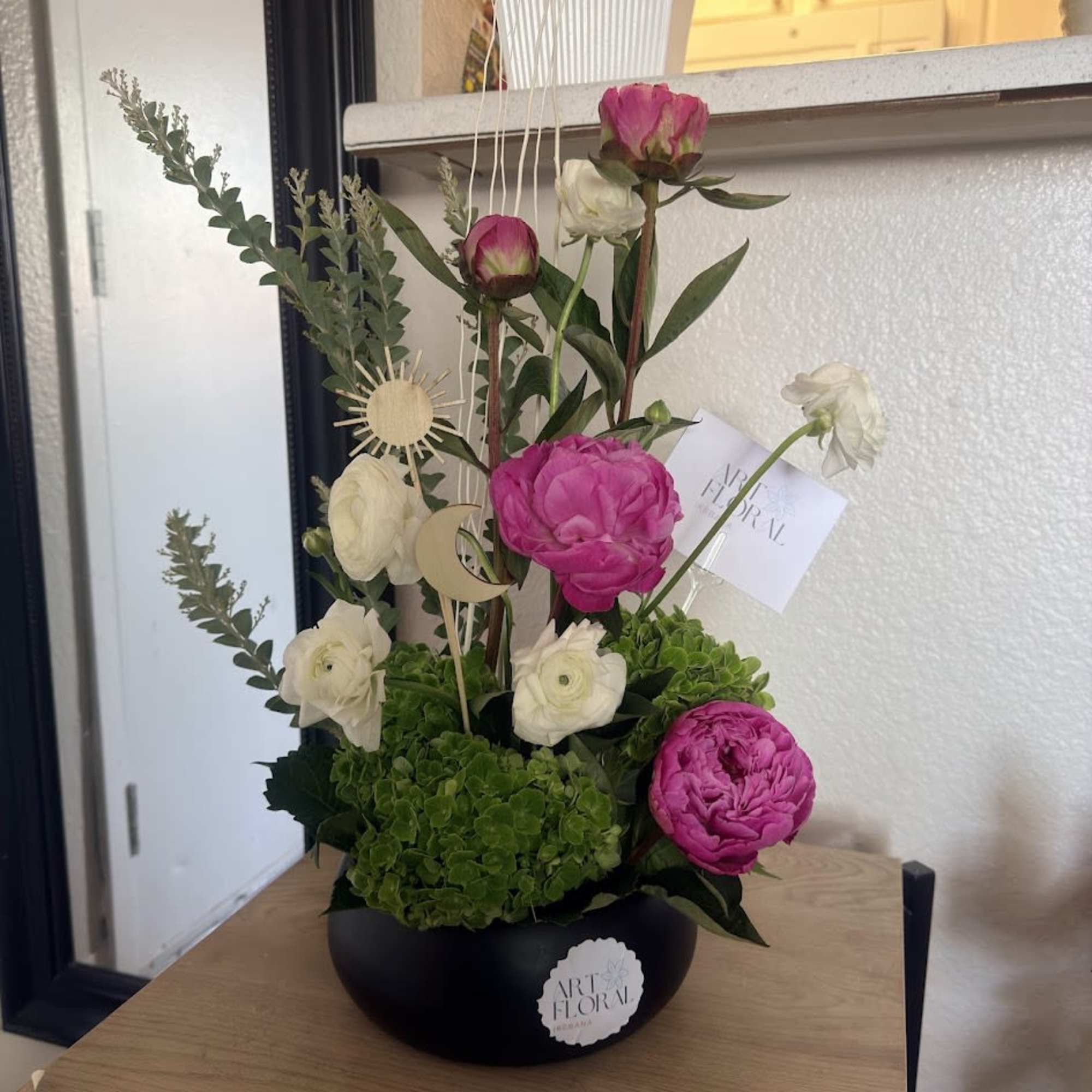 An elegant ikebana arrangement featuring the delicate beauty of peonies, the charming, photo 2 of 5