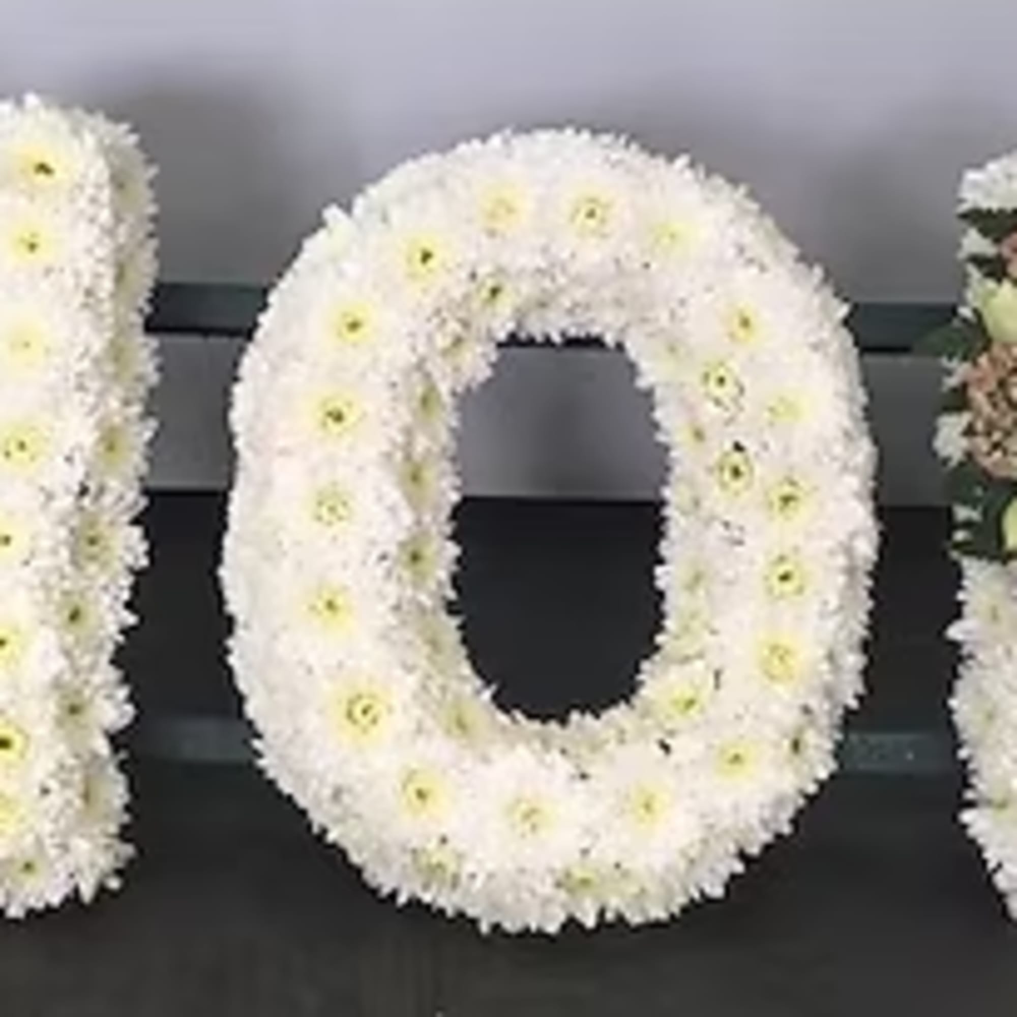 A beautiful and meaningful tribute, this custom sympathy arrangement is designed in