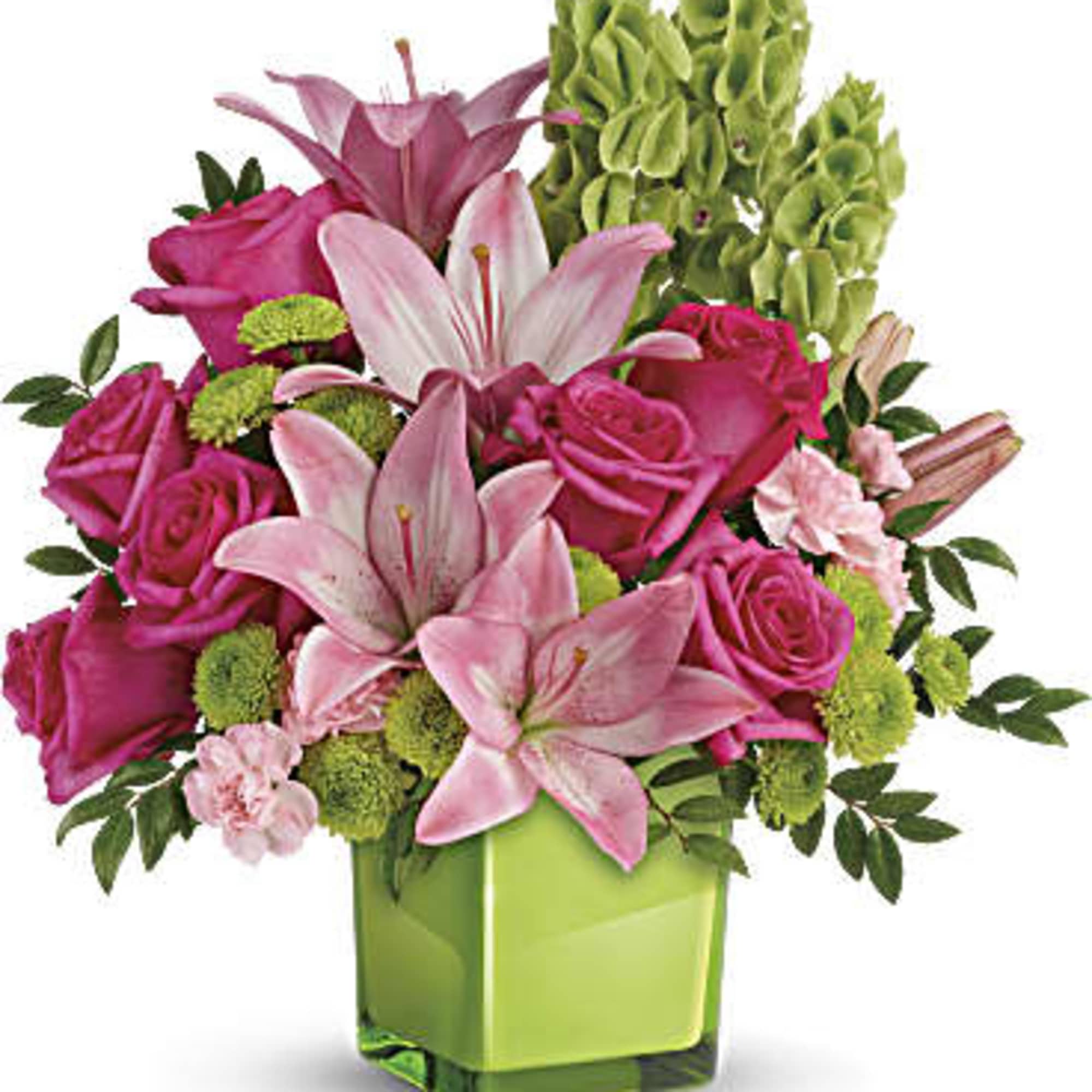 Pink lilies and roses in a green glass vase