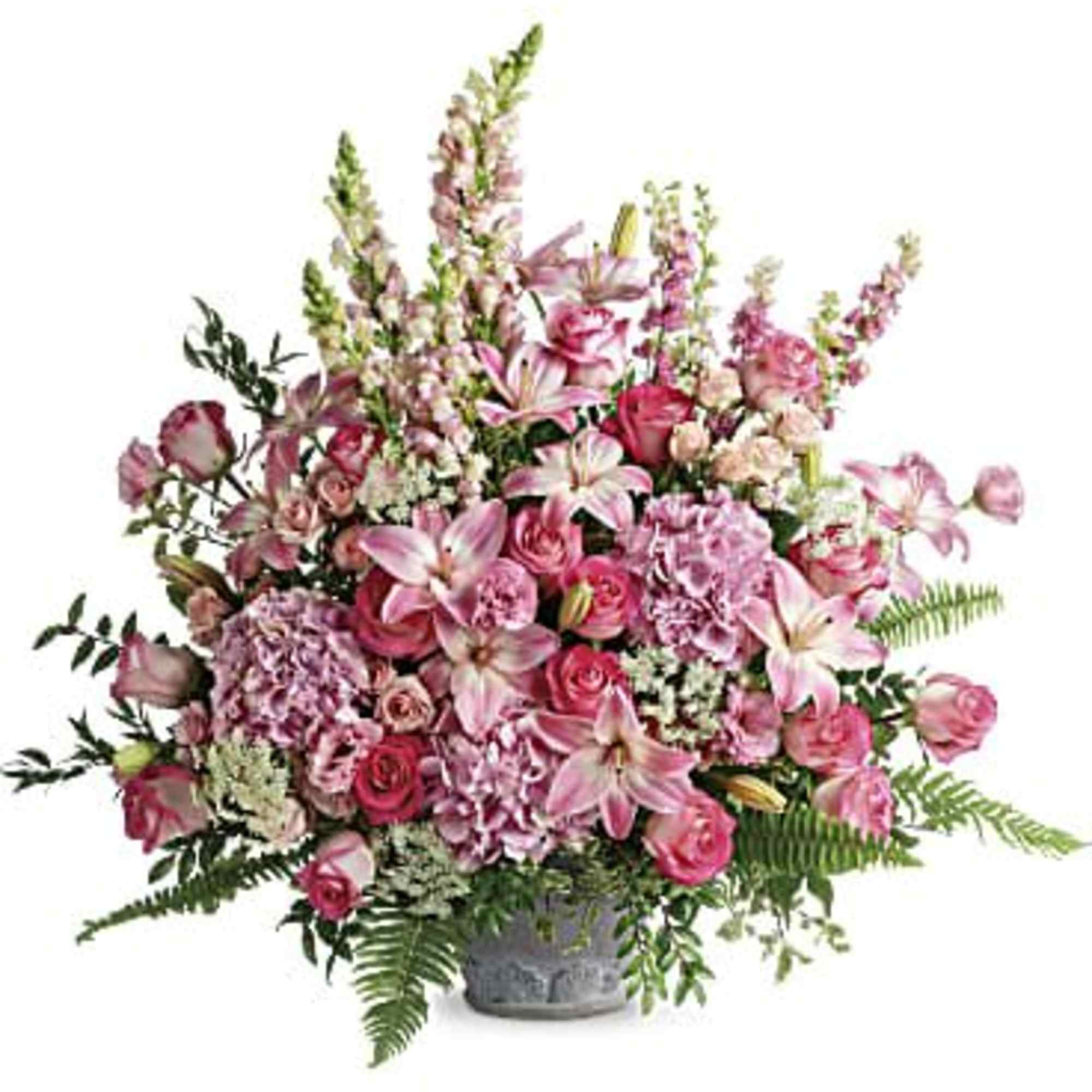 Pink mixed flower arrangement in a gray vase