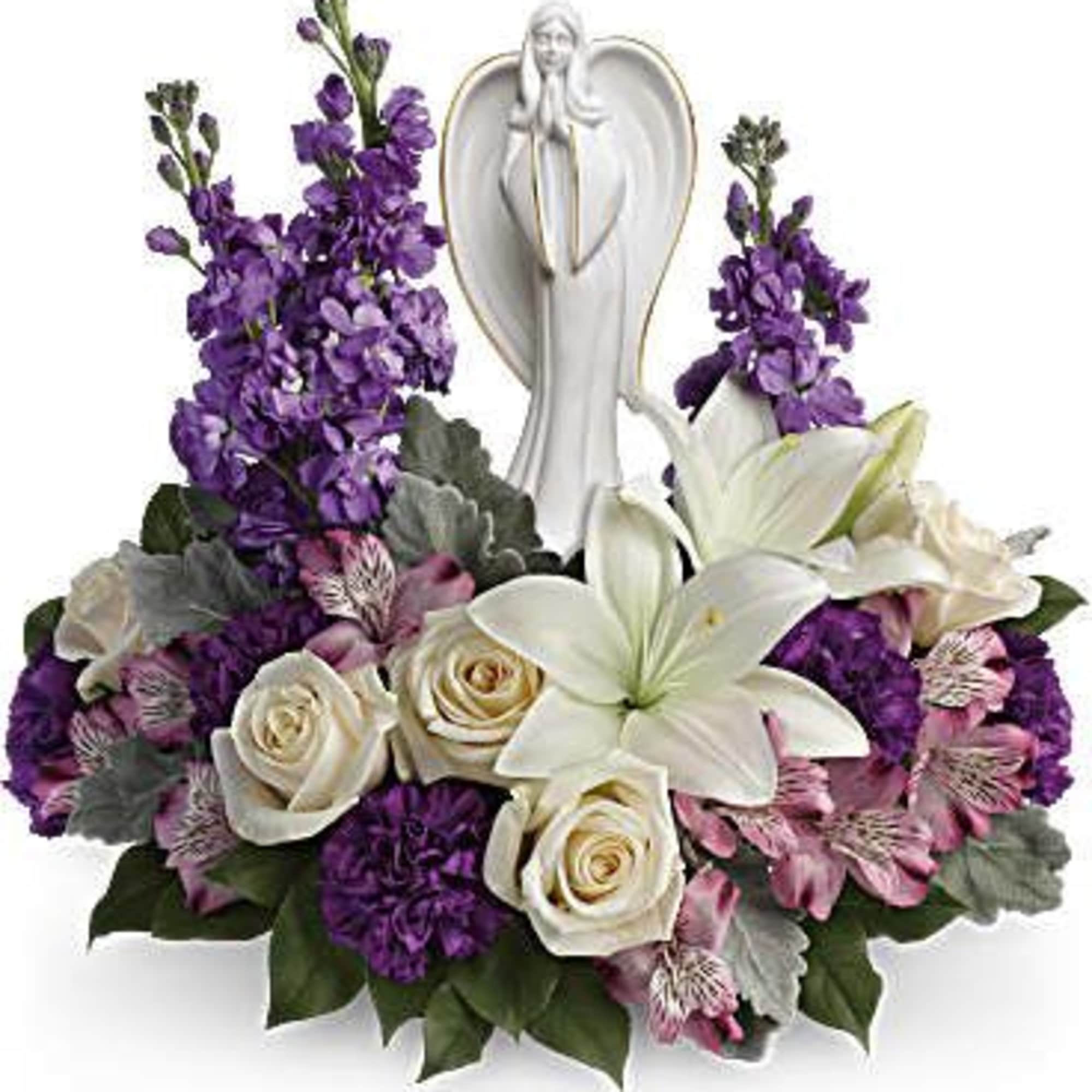 Purple and white floral arrangement with an angel figurine centerpiece