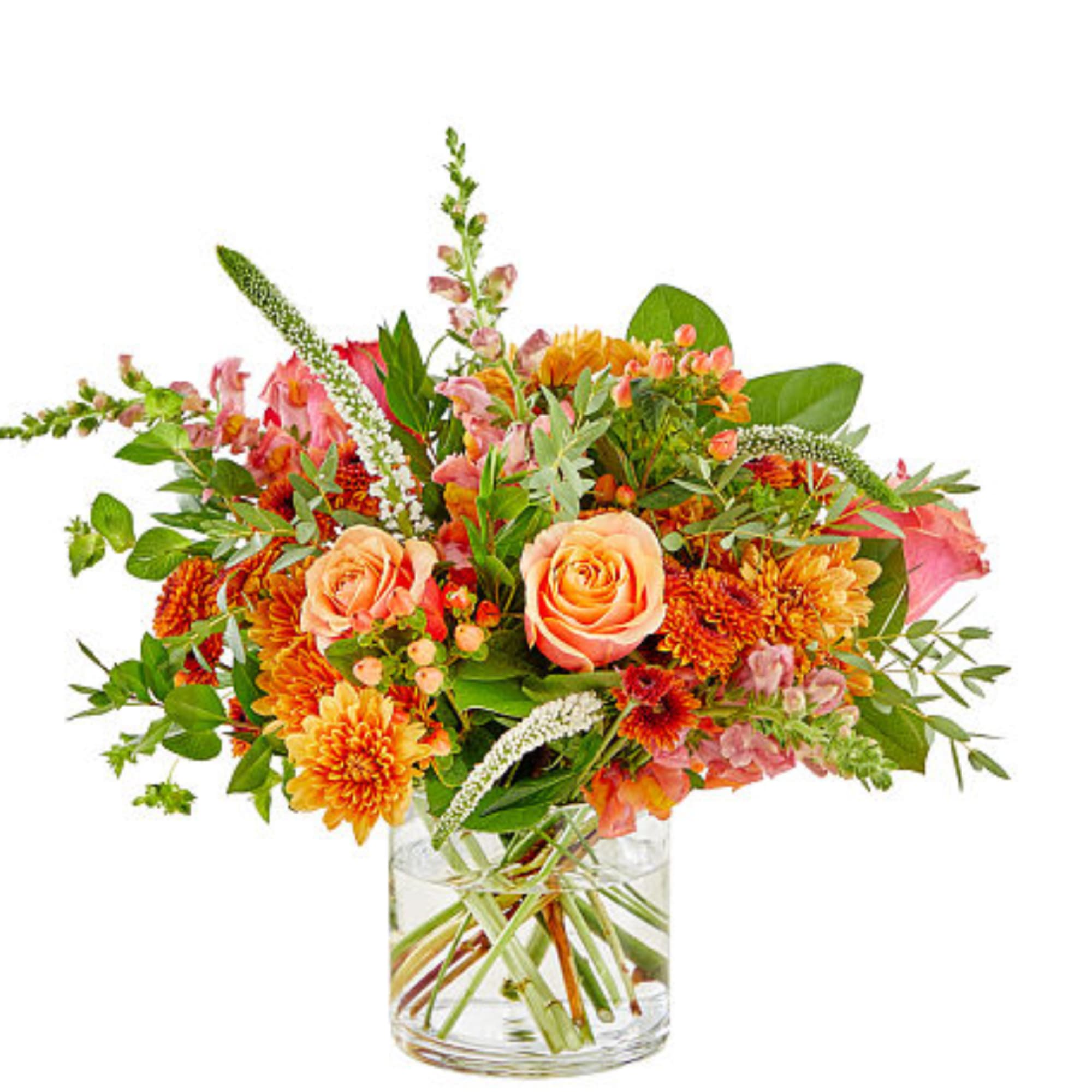 Peach roses and orange flowers in a clear glass vase