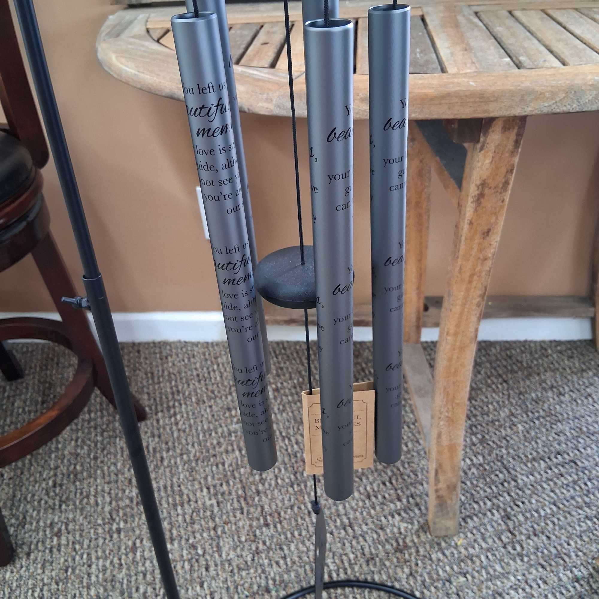 Set of gray hanging wind chimes with printed text