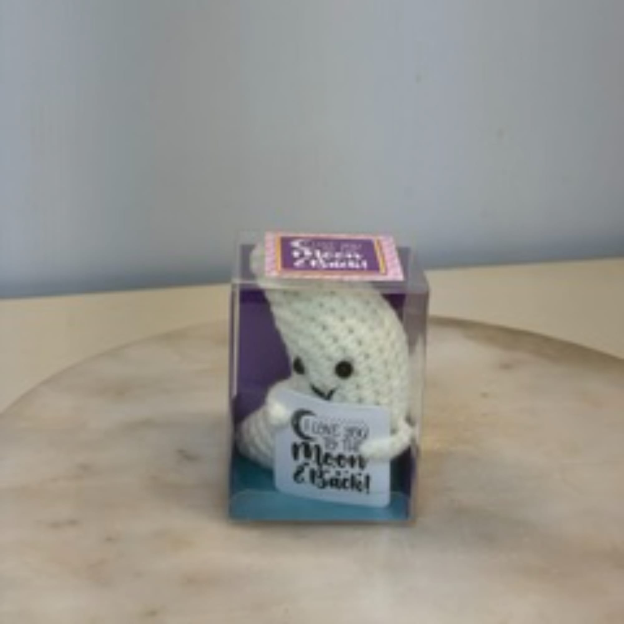 Crocheted ghost plush in a clear gift box