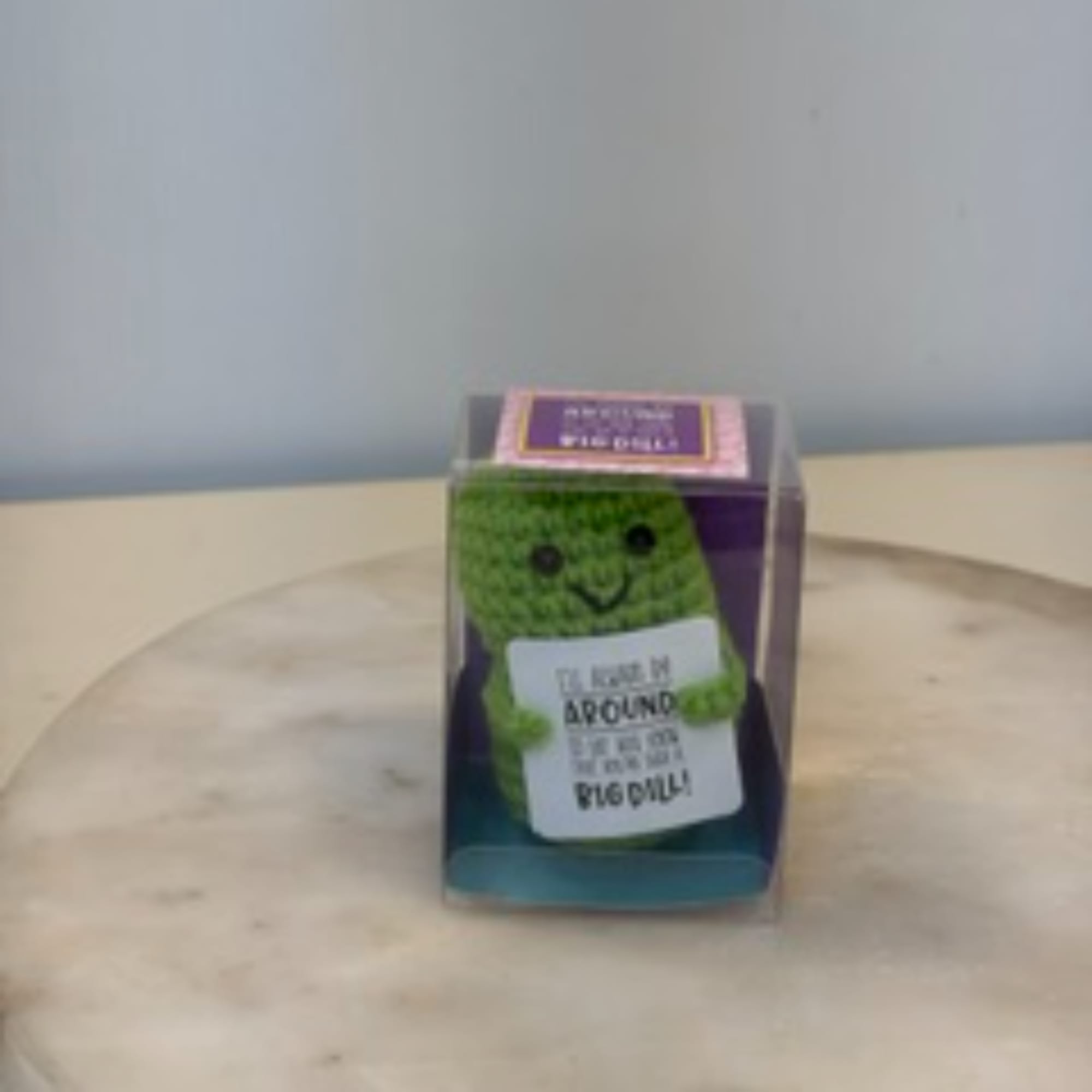 Small green plush toy in a clear display box, photo 5 of 9