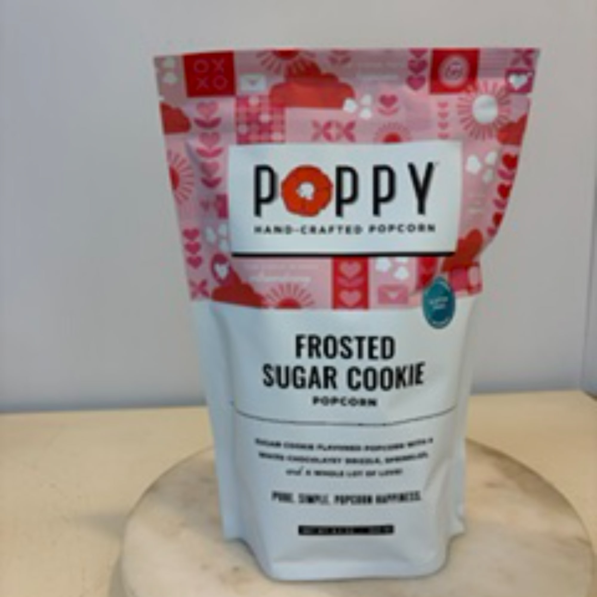 Bag of Poppy frosted sugar cookie popcorn on a table
