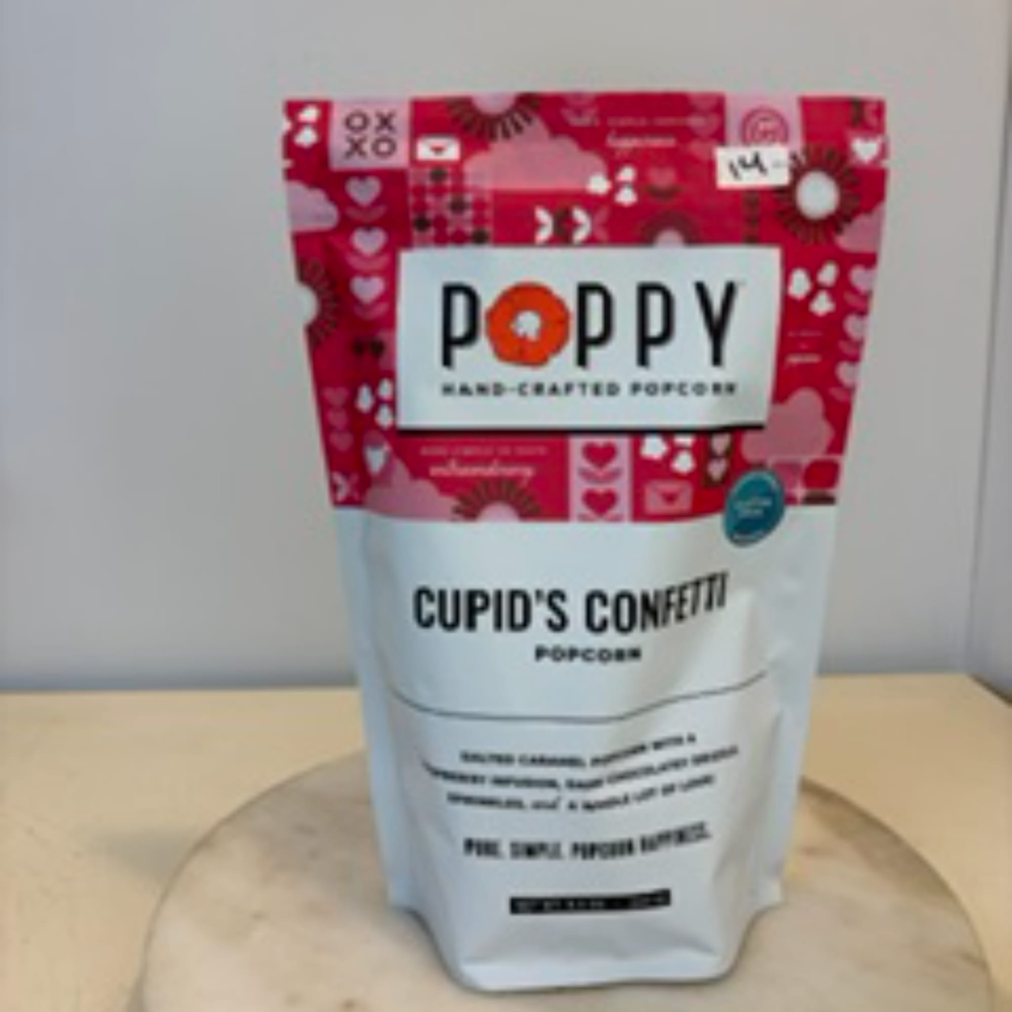 Bag of Poppy Cupid's Confetti popcorn on a table