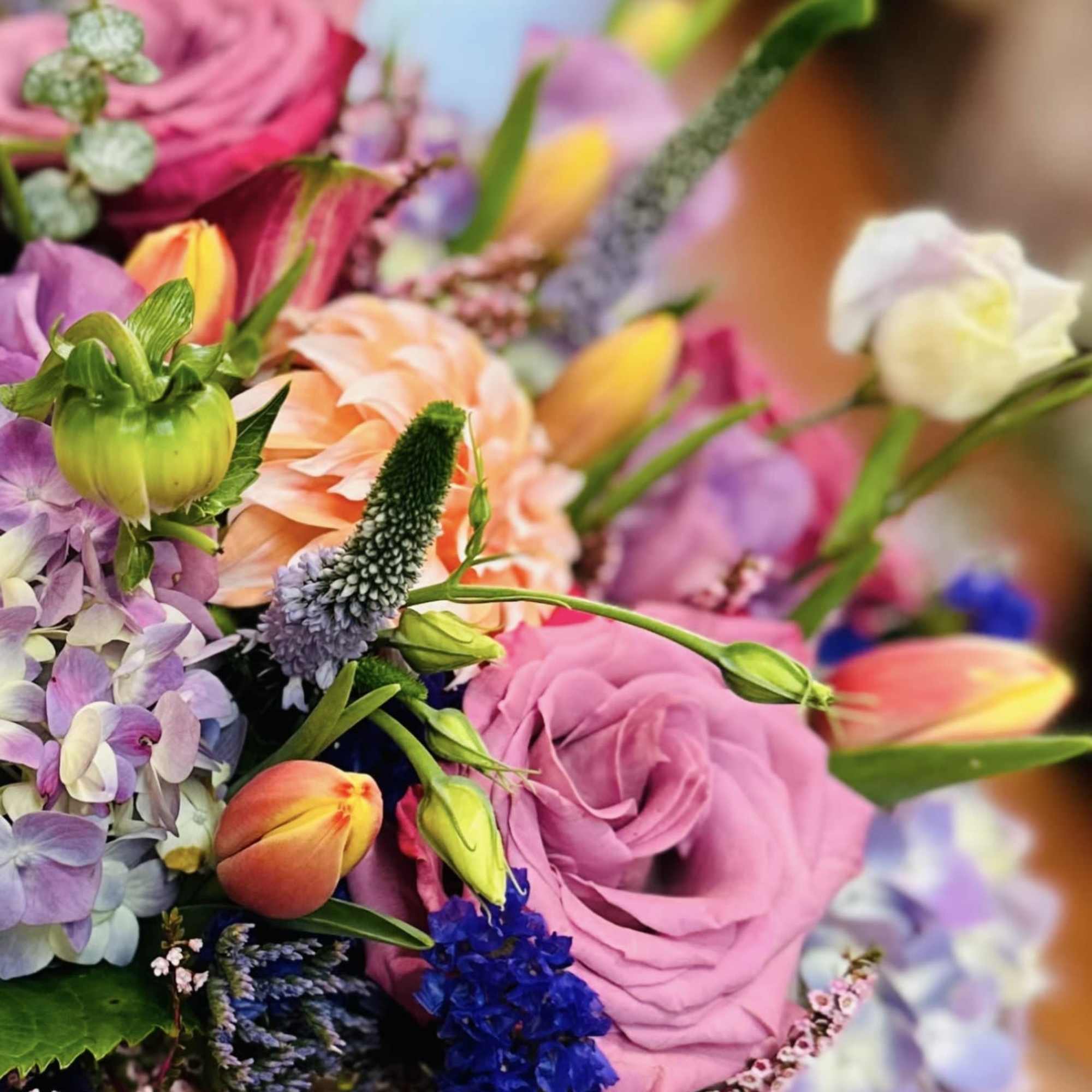 This lovely arrangement comes in a low cylinder vase with vibrant tulips, photo 2 of 2