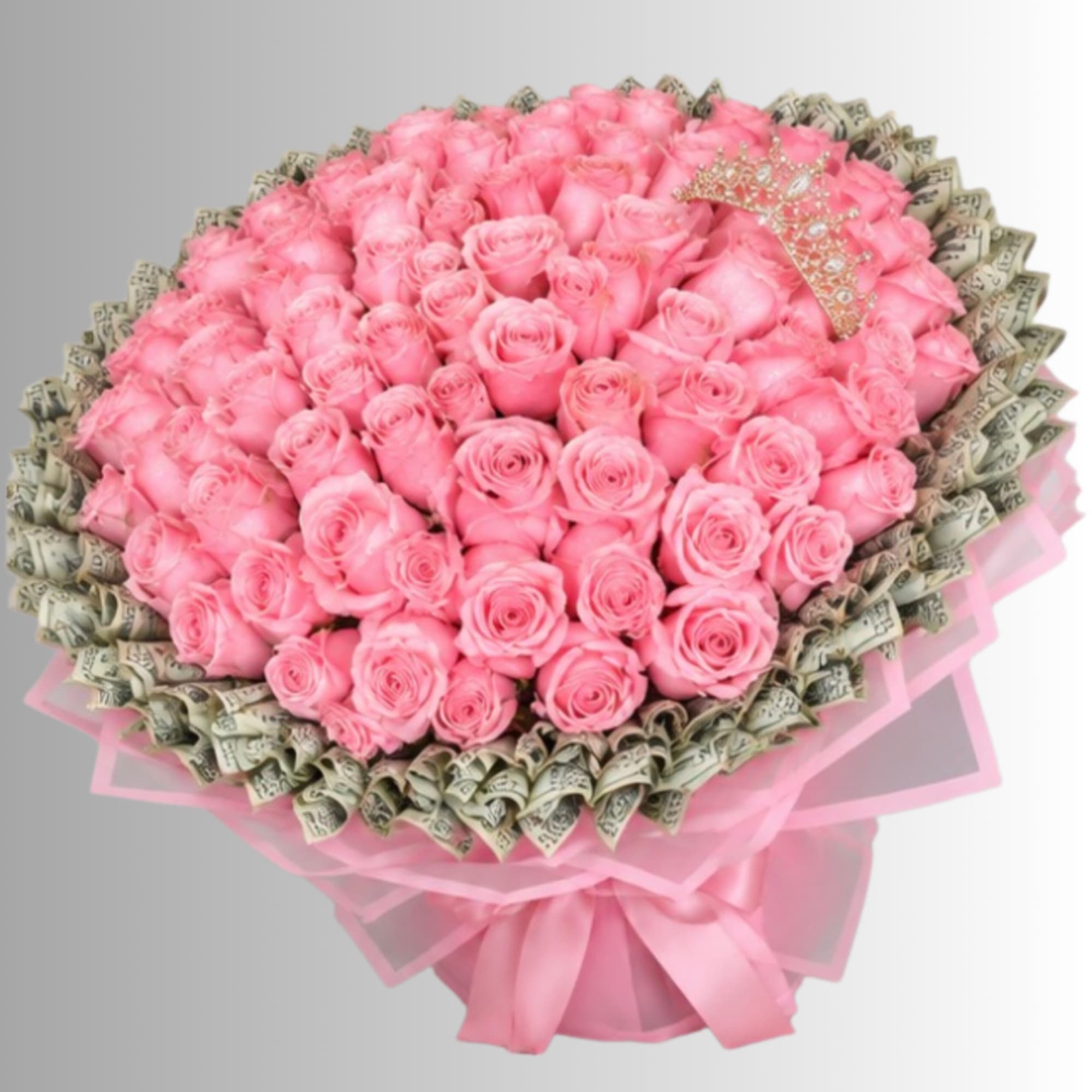 Large bouquet of pink roses wrapped with pink ribbon and dollar bills