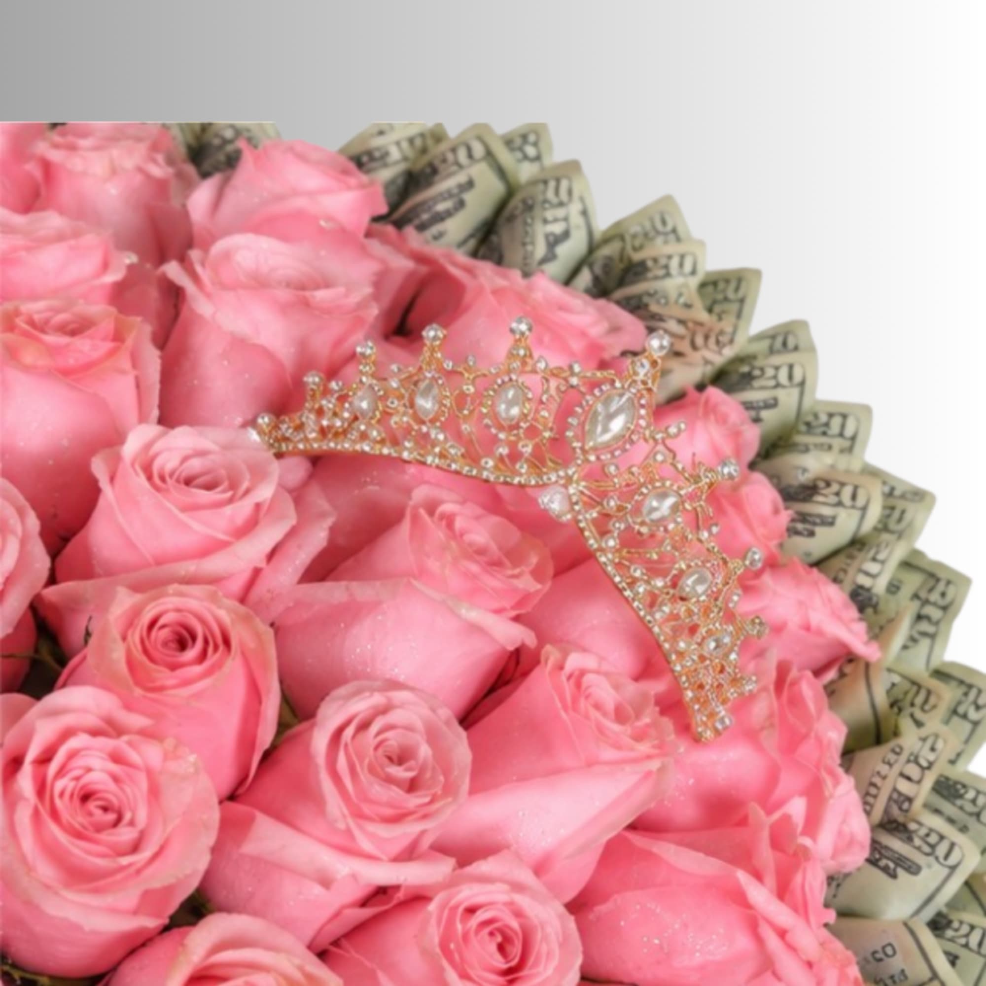 Pink roses arranged with folded dollar bills and a jeweled tiara