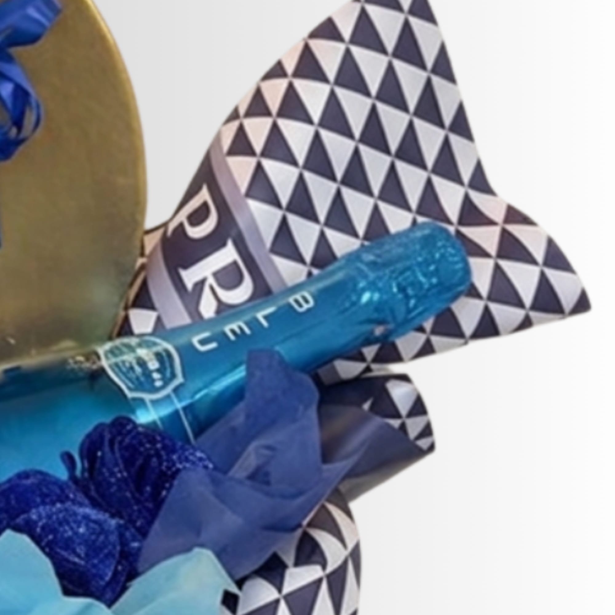 Blue champagne bottle with geometric wrapping and ribbon
