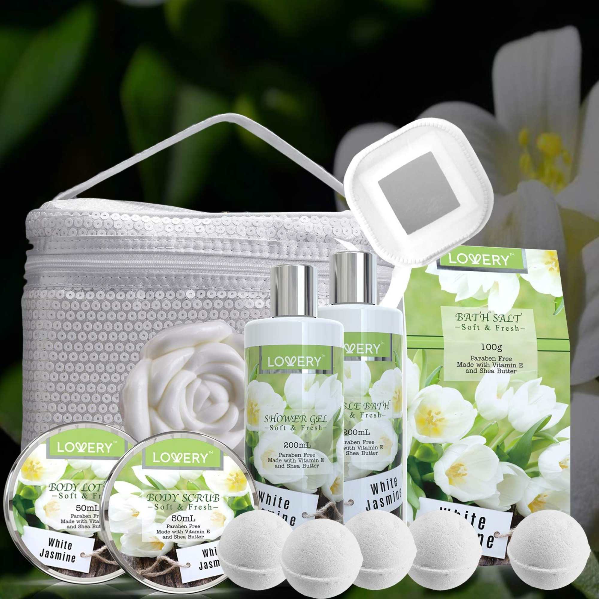 White jasmine-scented bath and body gift set with bottles, jars, bath bombs, and a white cosmetic bag