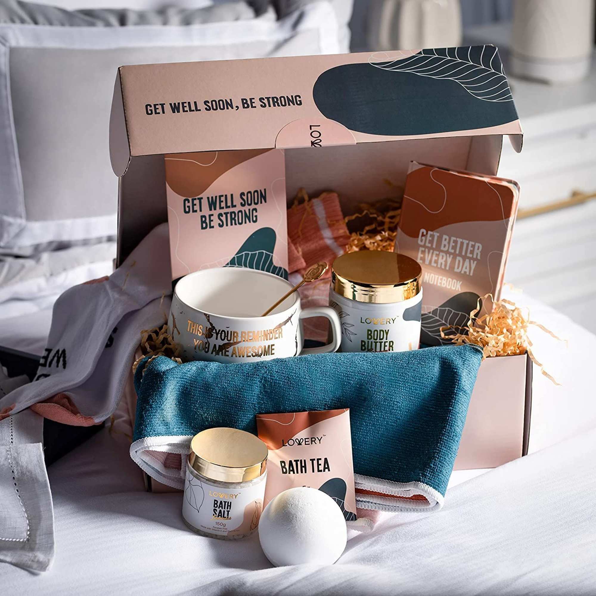Get well gift box with mug, body butter, bath products, towel, and encouraging messages.