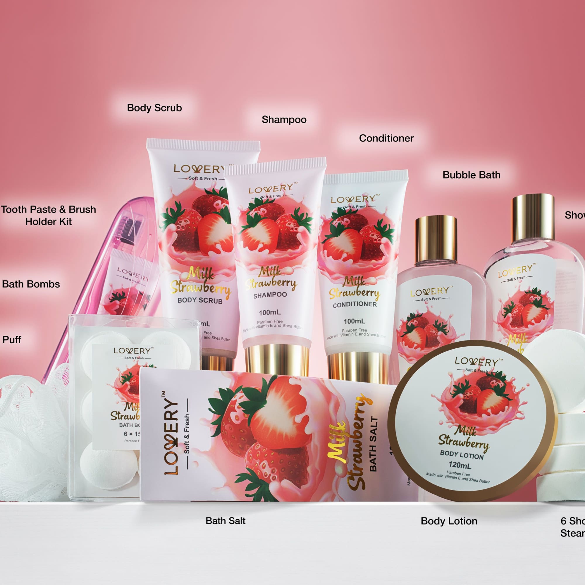 Strawberry-themed pink and white bath and body gift set with bottles, jars, and bath accessories