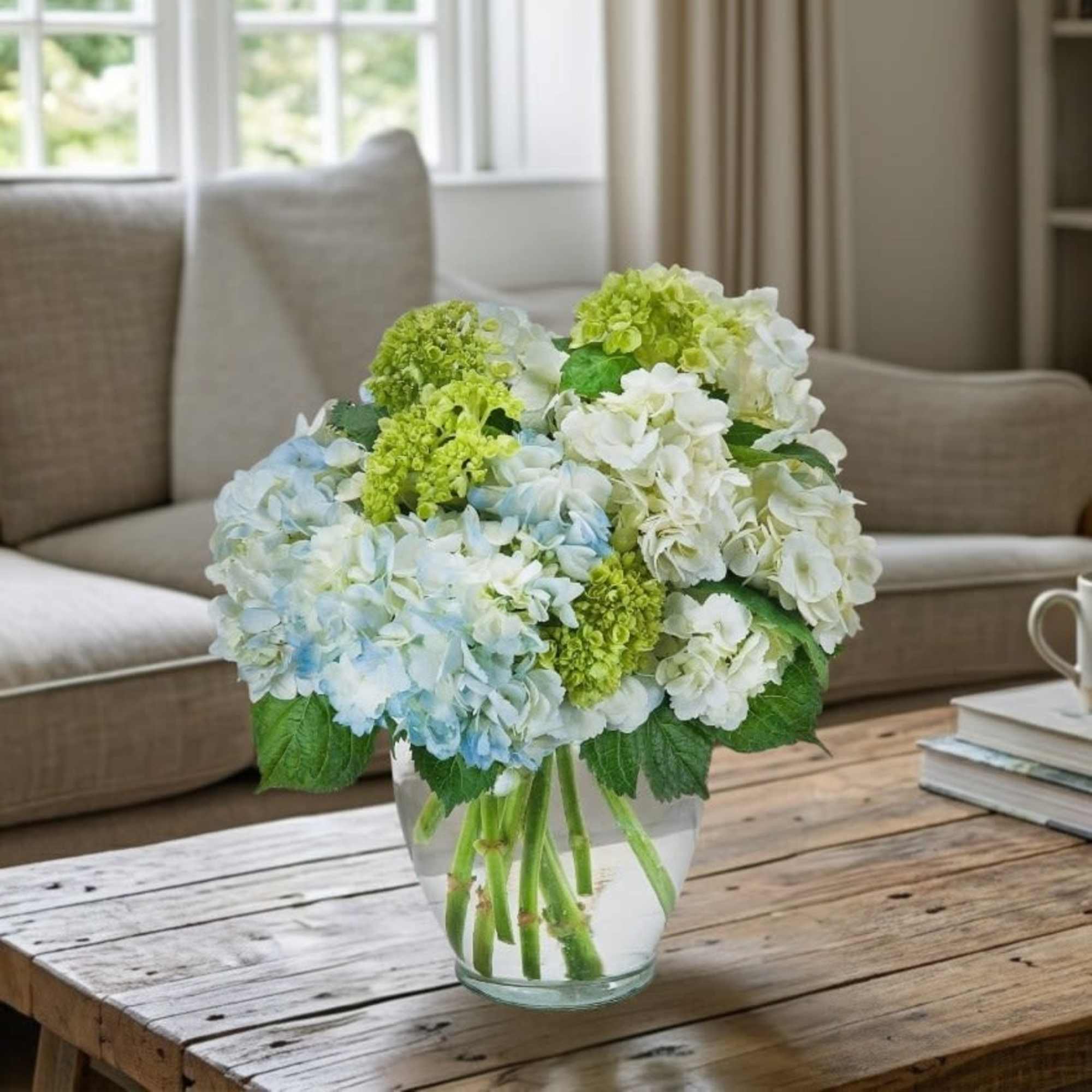 A clear vase filled with beautiful hydrangea.