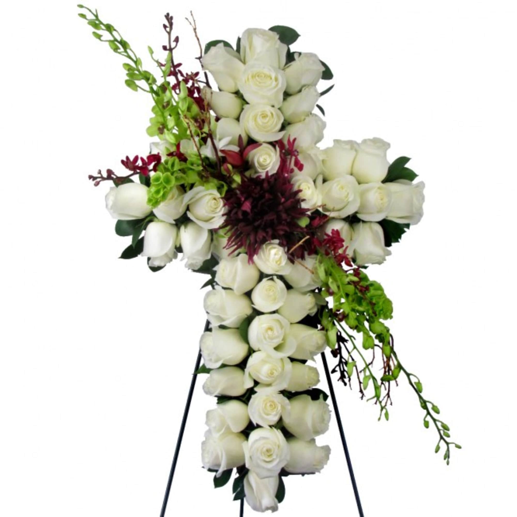 White rose cross arrangement with burgundy and green accents on a stand