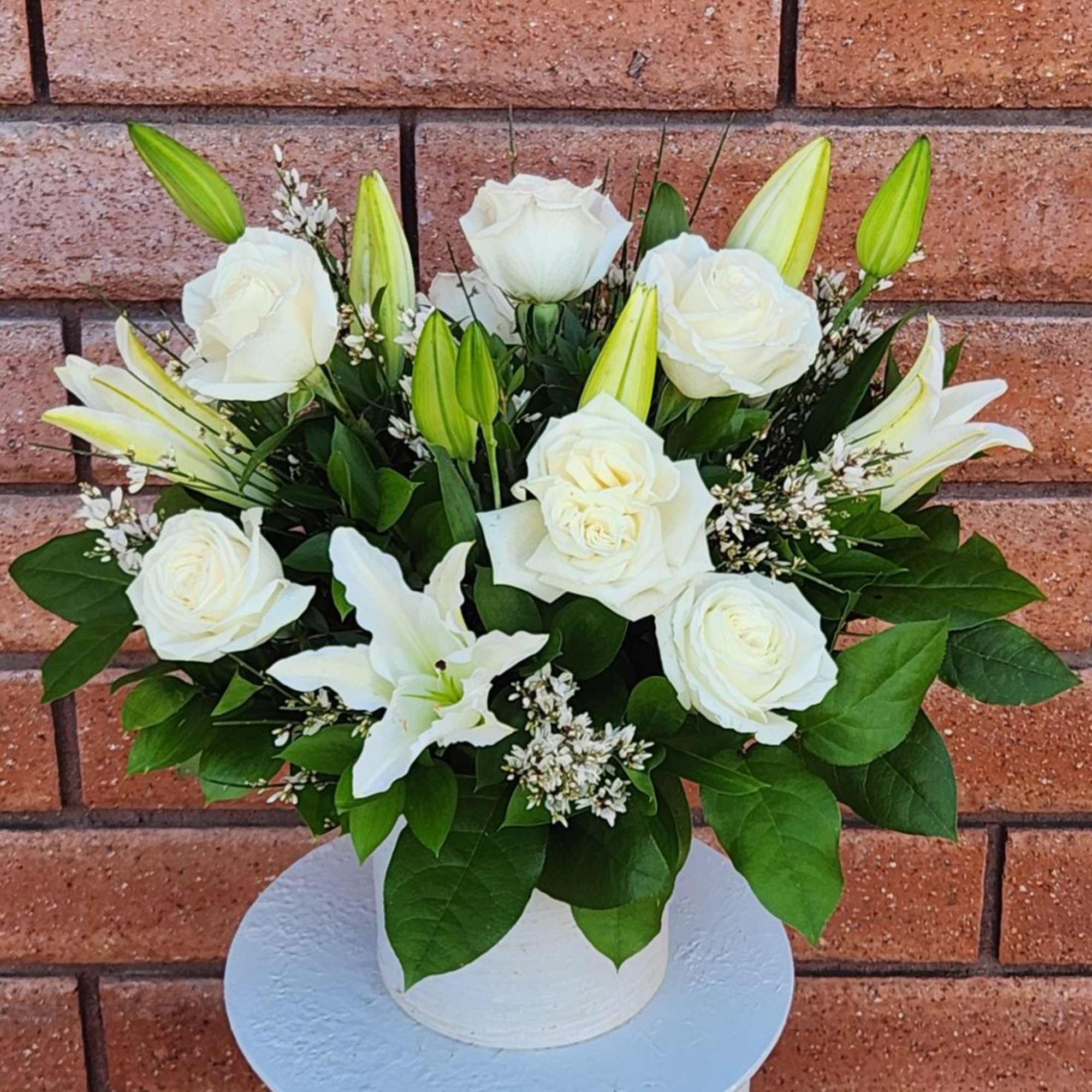 White roses and lilies arranged in a white vase, photo 3 of 4