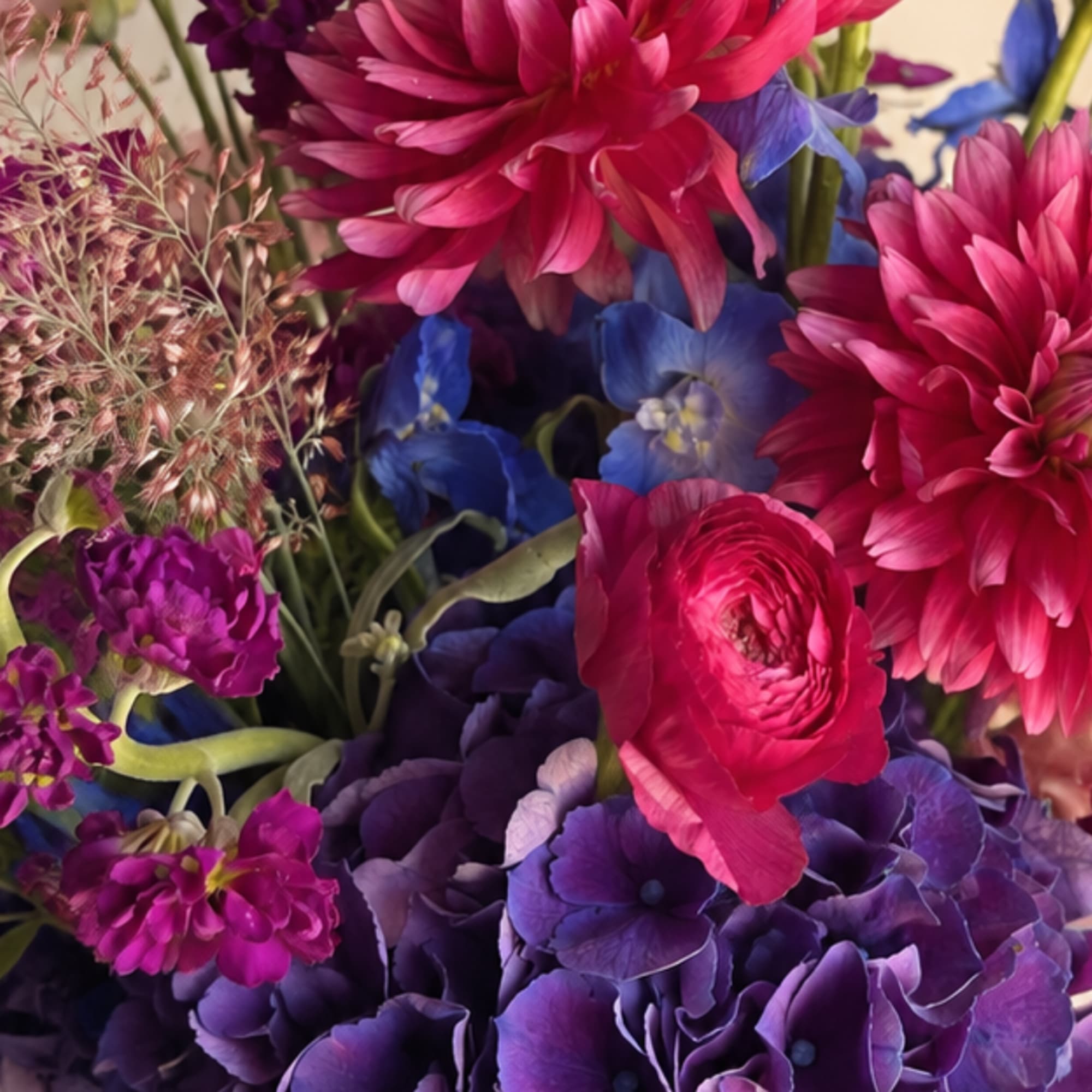 Close-up bouquet of magenta, purple, and blue flowers