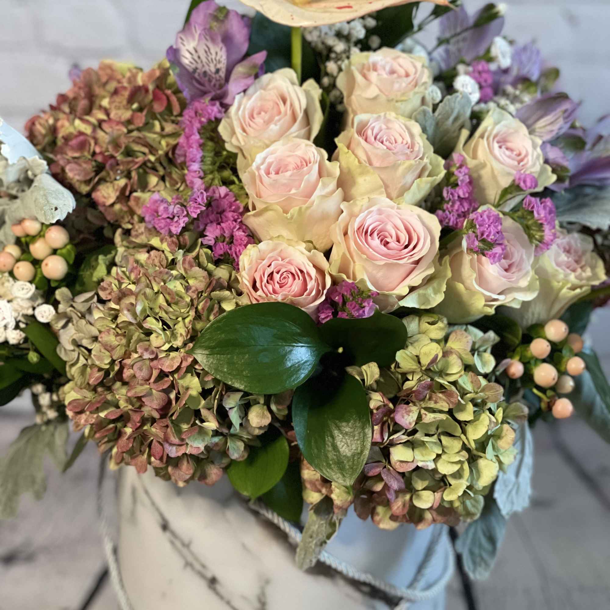 Bouquet of pale pink roses and hydrangeas with purple accents, photo 2 of 5