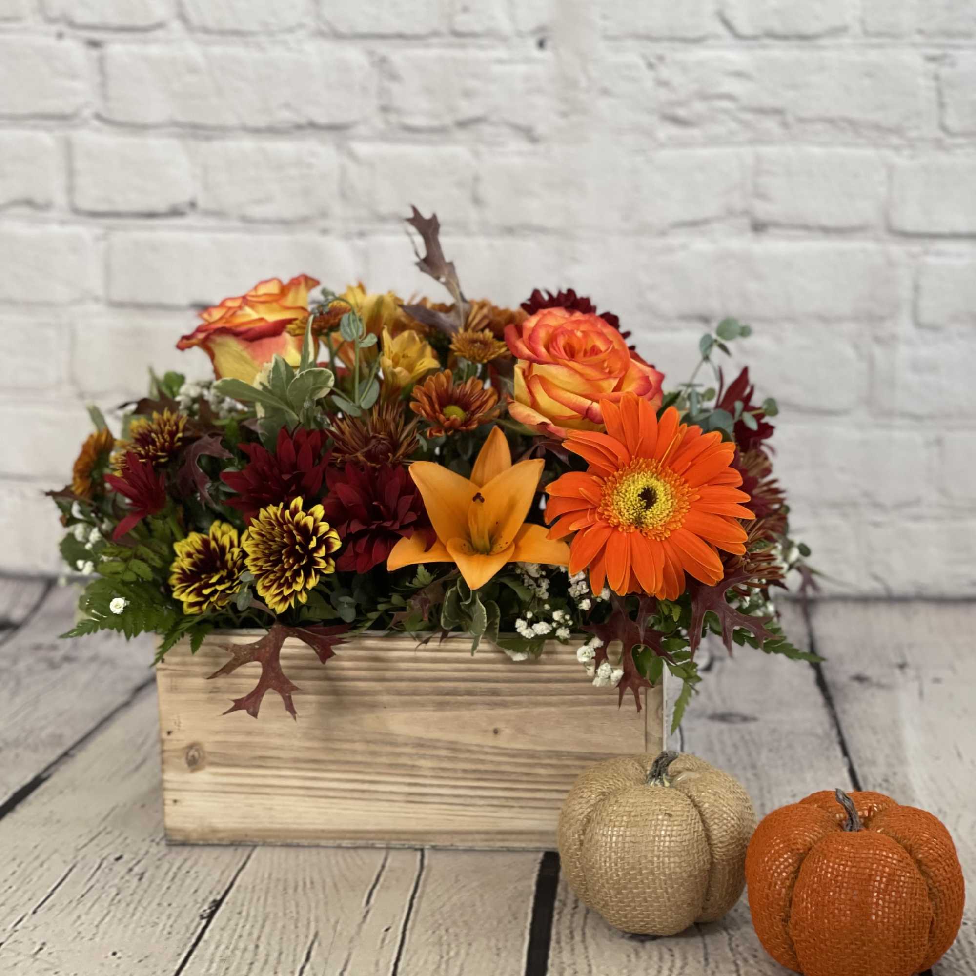 The Woodland Harvest floral arrangement is a striking tribute to the autumn