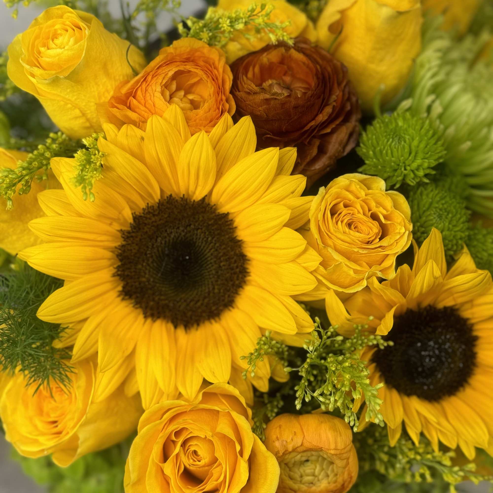 Yellow bouquet with sunflowers and roses
