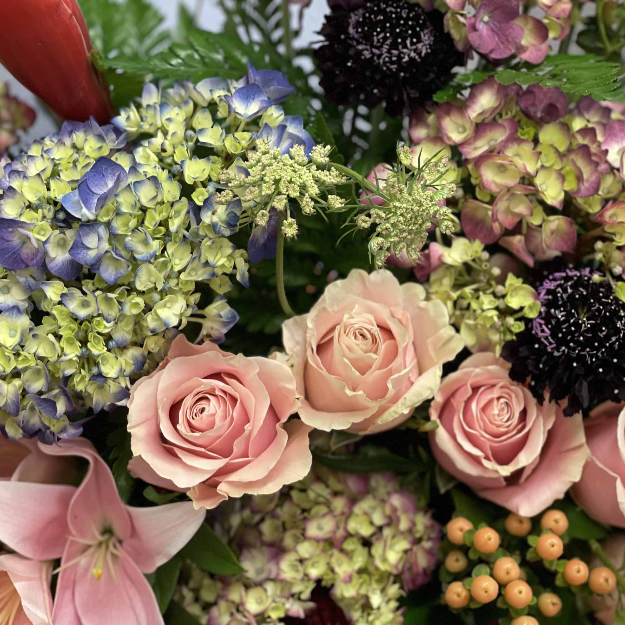 Bouquet of pink roses and mixed hydrangeas with lilies