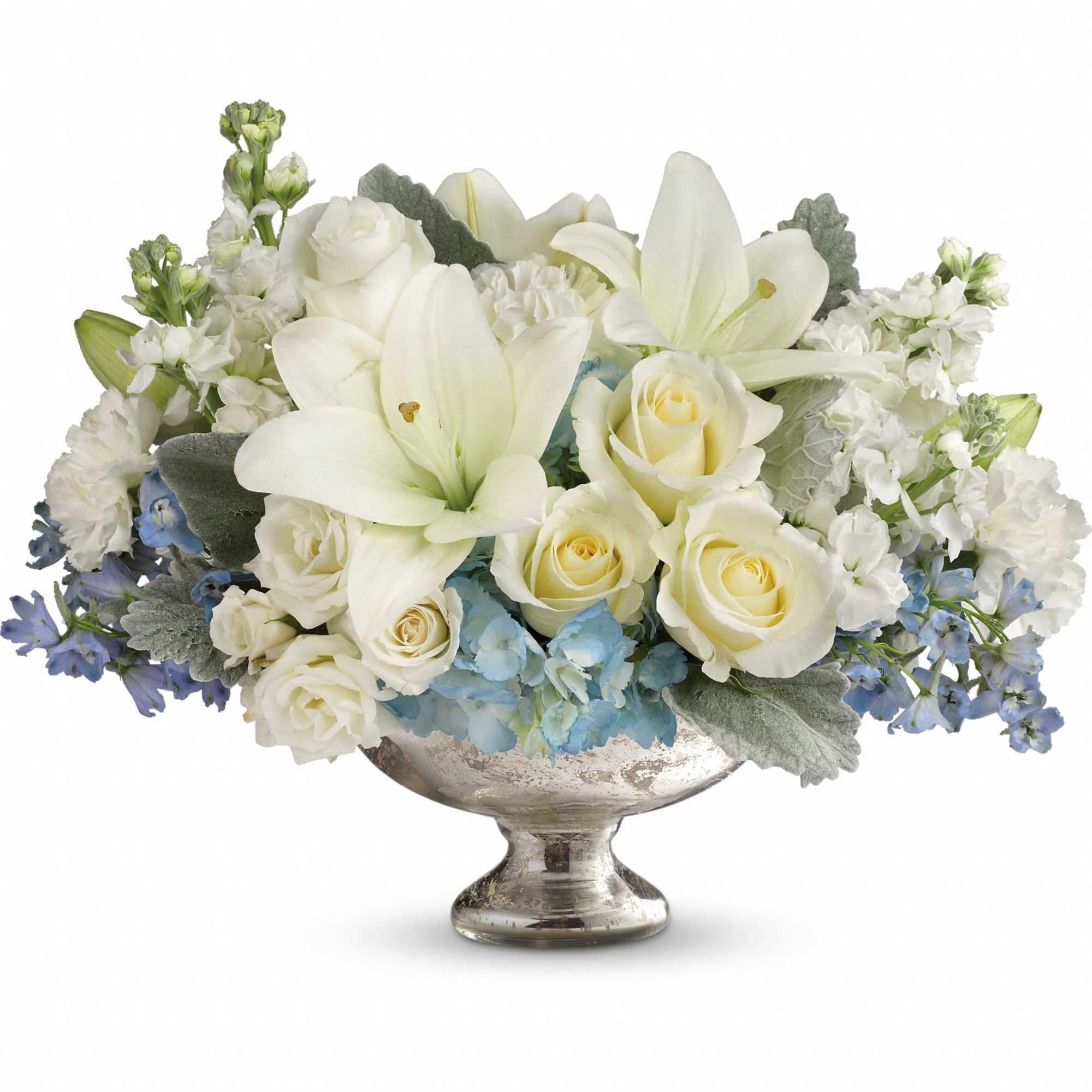 White lilies and roses in a silver pedestal bowl