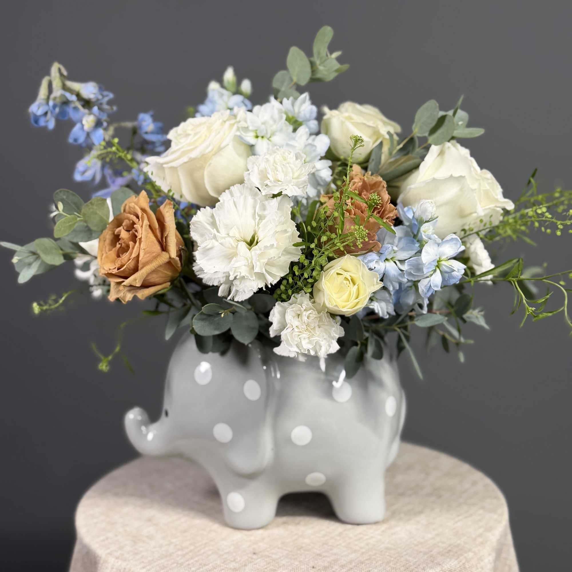A charming baby boy arrangement featuring soft blue blooms, creamy white roses, photo 2 of 3