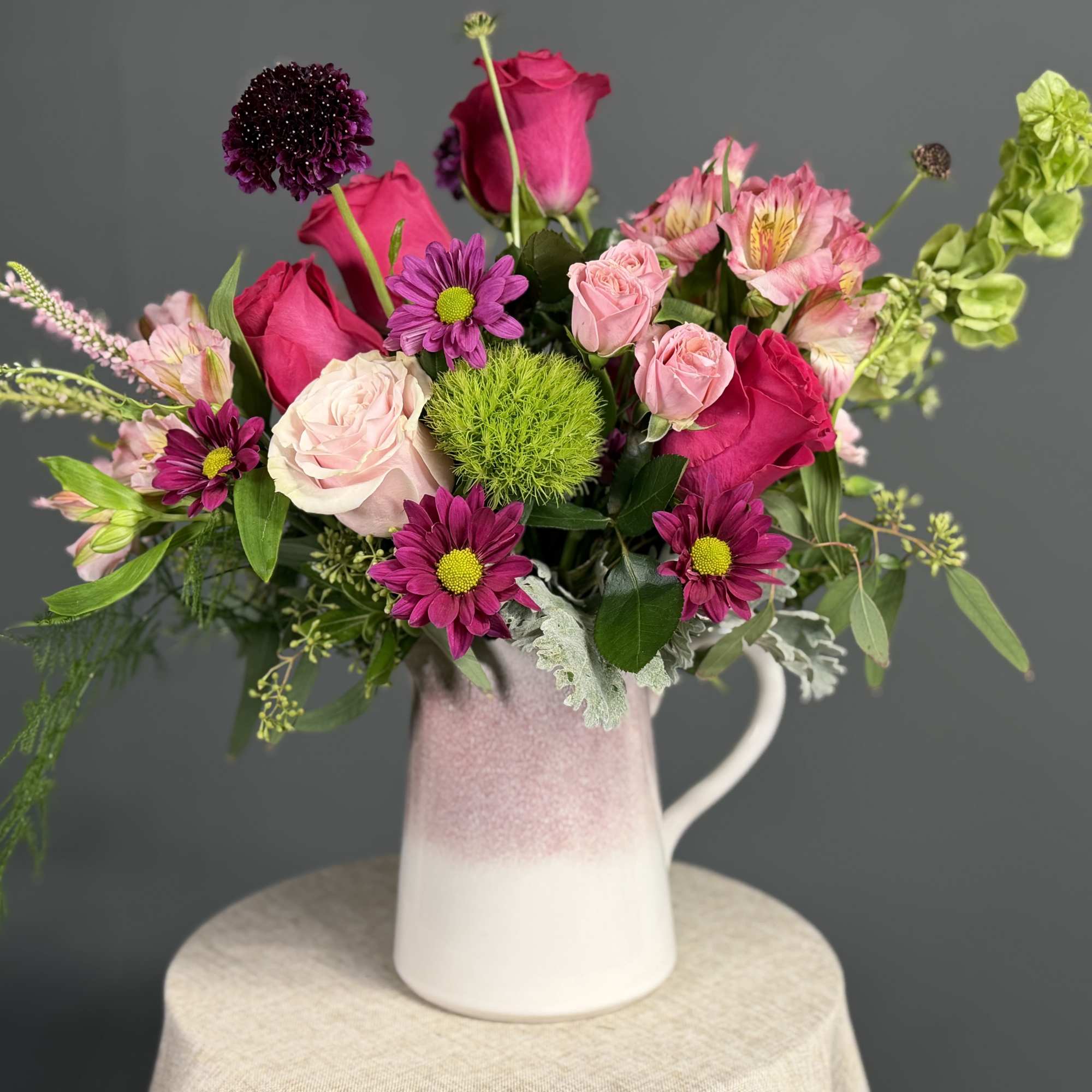 Capturing the untamed beauty of a wild meadow, this vibrant arrangement is, photo 3 of 3