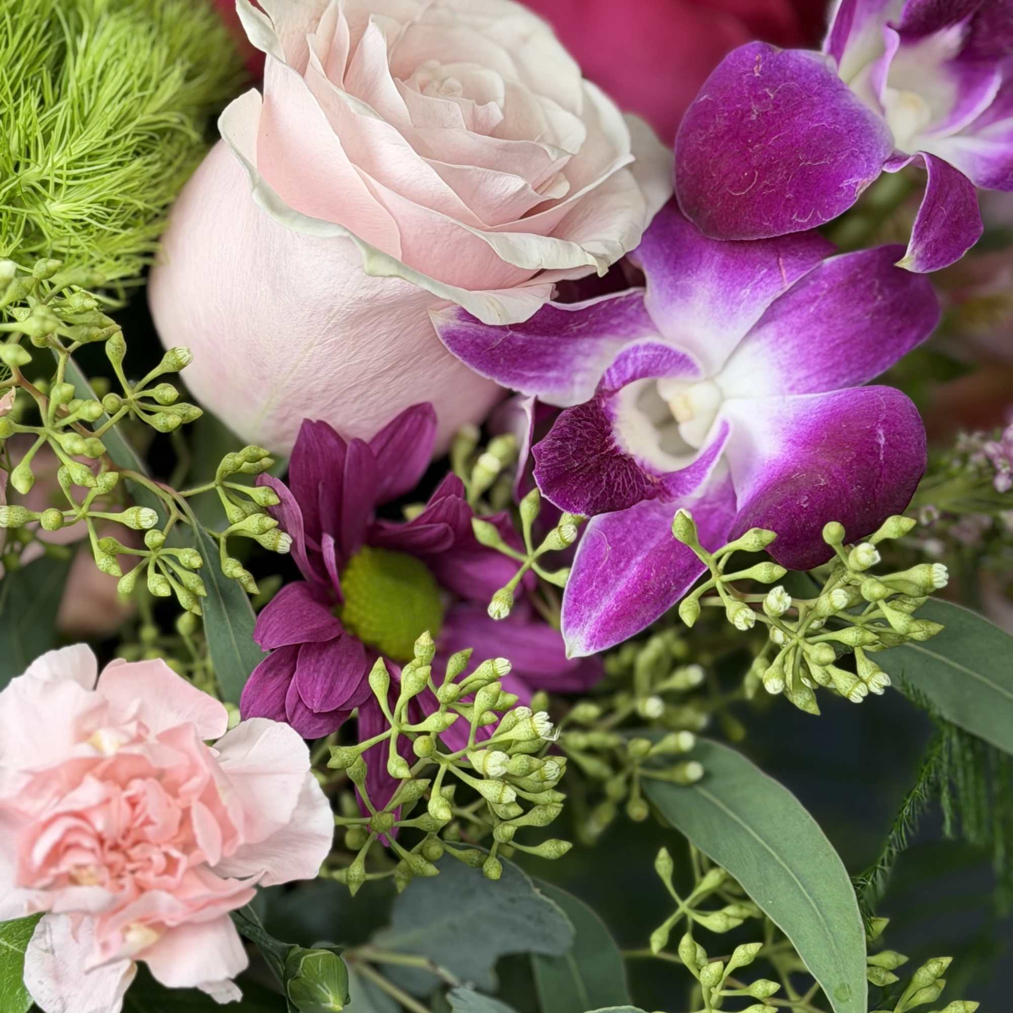 Capturing the untamed beauty of a wild meadow, this vibrant arrangement is, photo 2 of 3