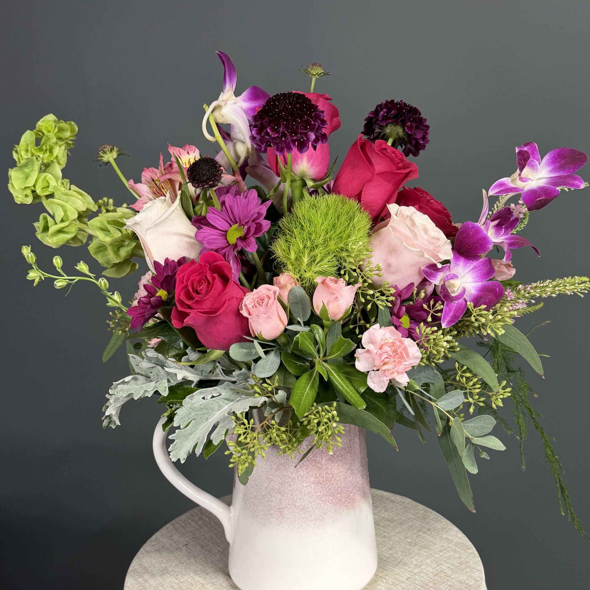 Capturing the untamed beauty of a wild meadow, this vibrant arrangement is, photo 3 of 3