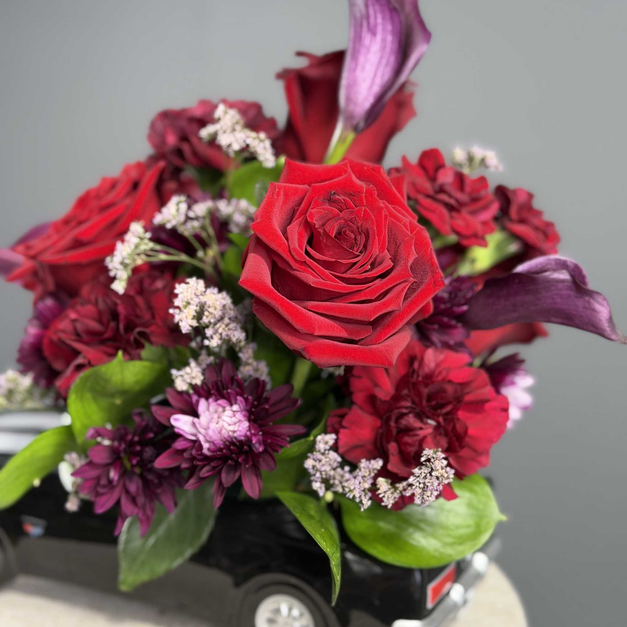 Deep, romantic reds and plum tones are tucked into a glossy ceramic, photo 2 of 2
