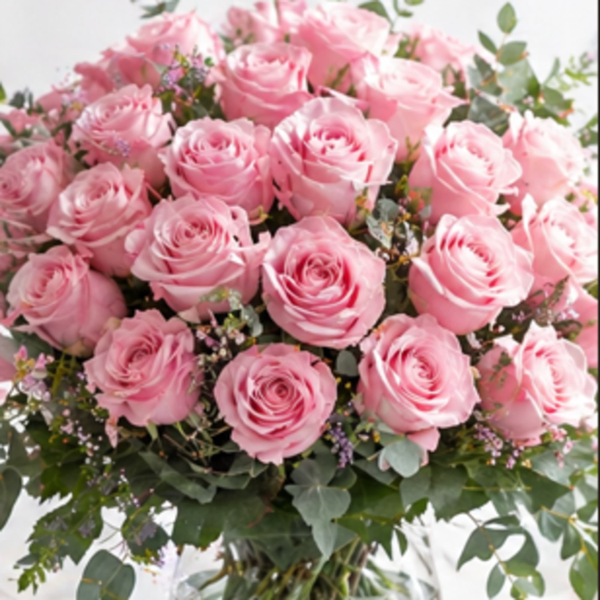 Picture-perfect soft pink roses make a beautiful gift for the lovely lady