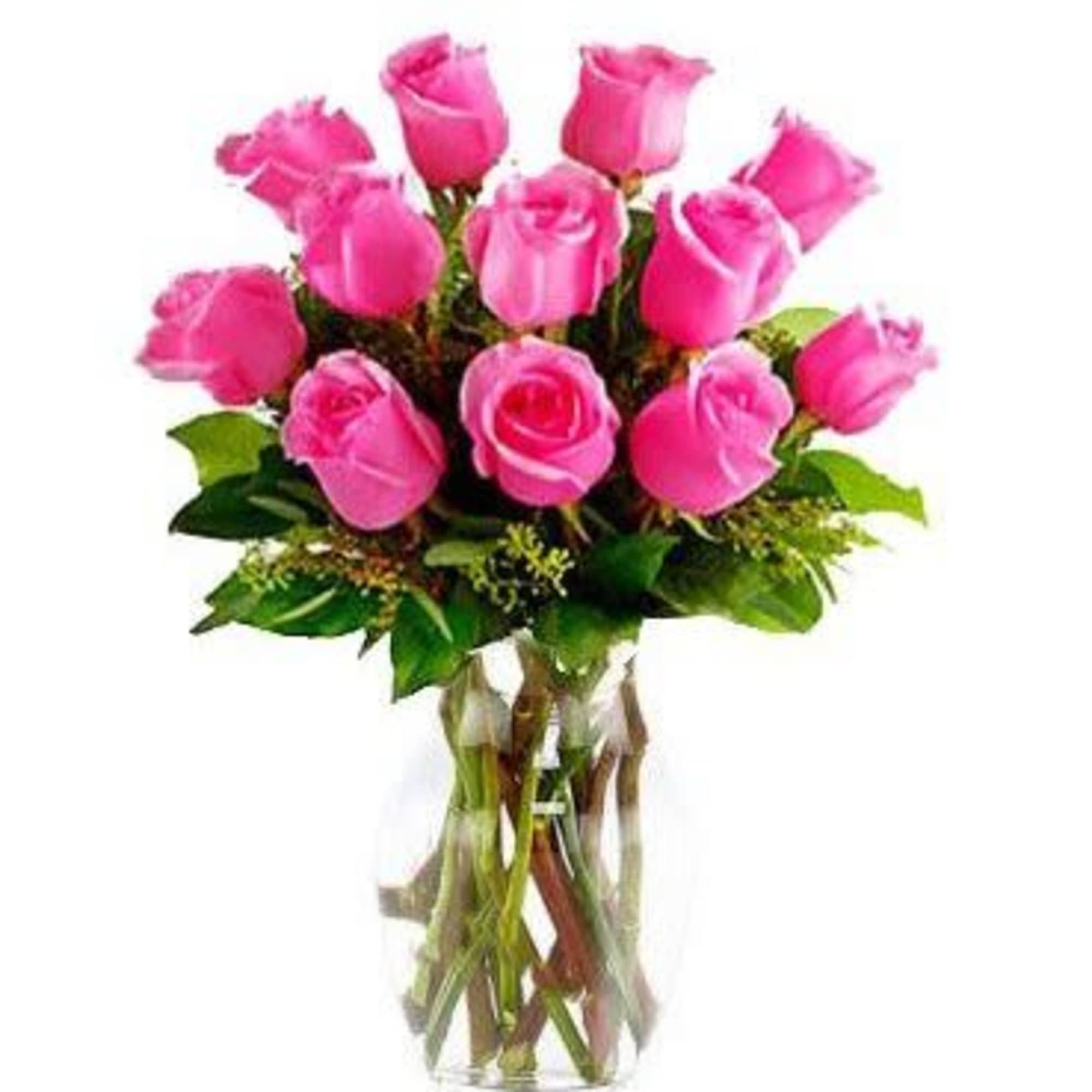 Pink roses arranged in a clear glass vase