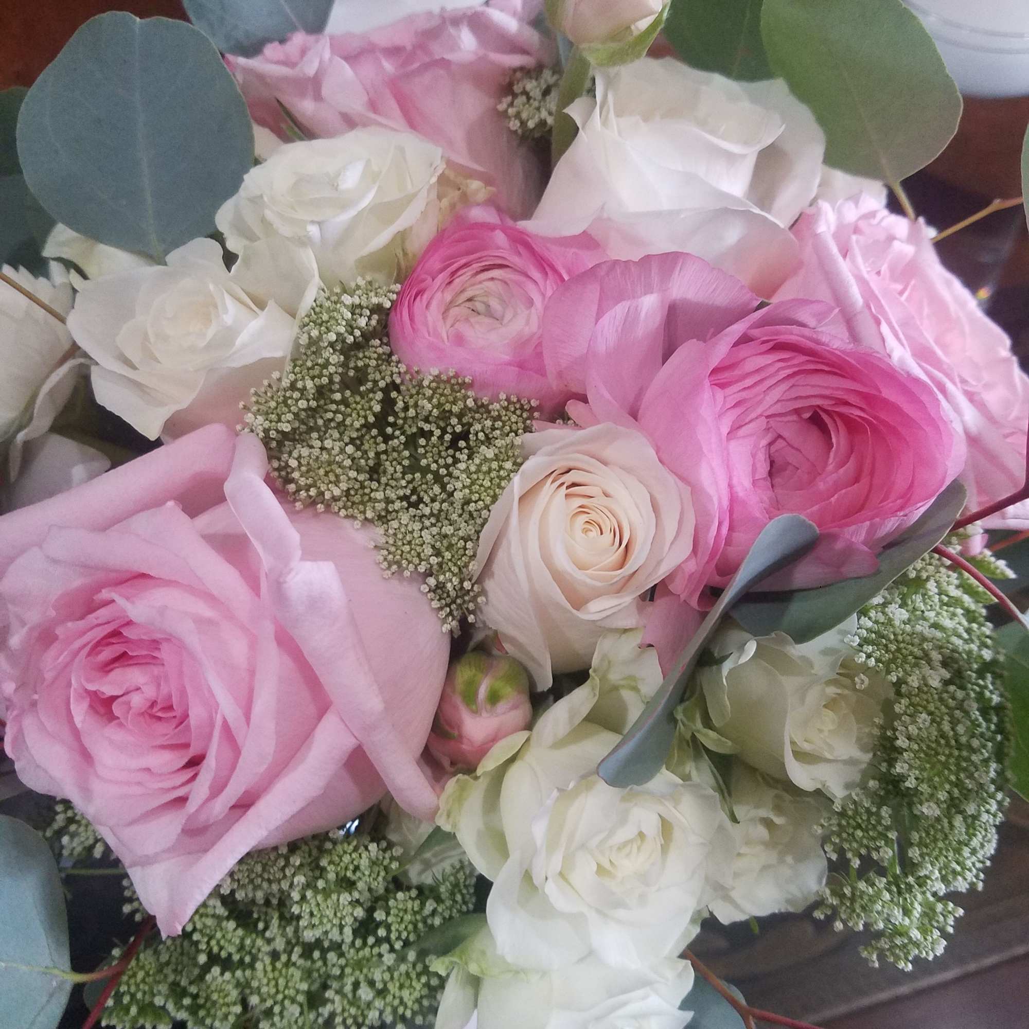 Pink and white rose bouquet with eucalyptus and filler flowers