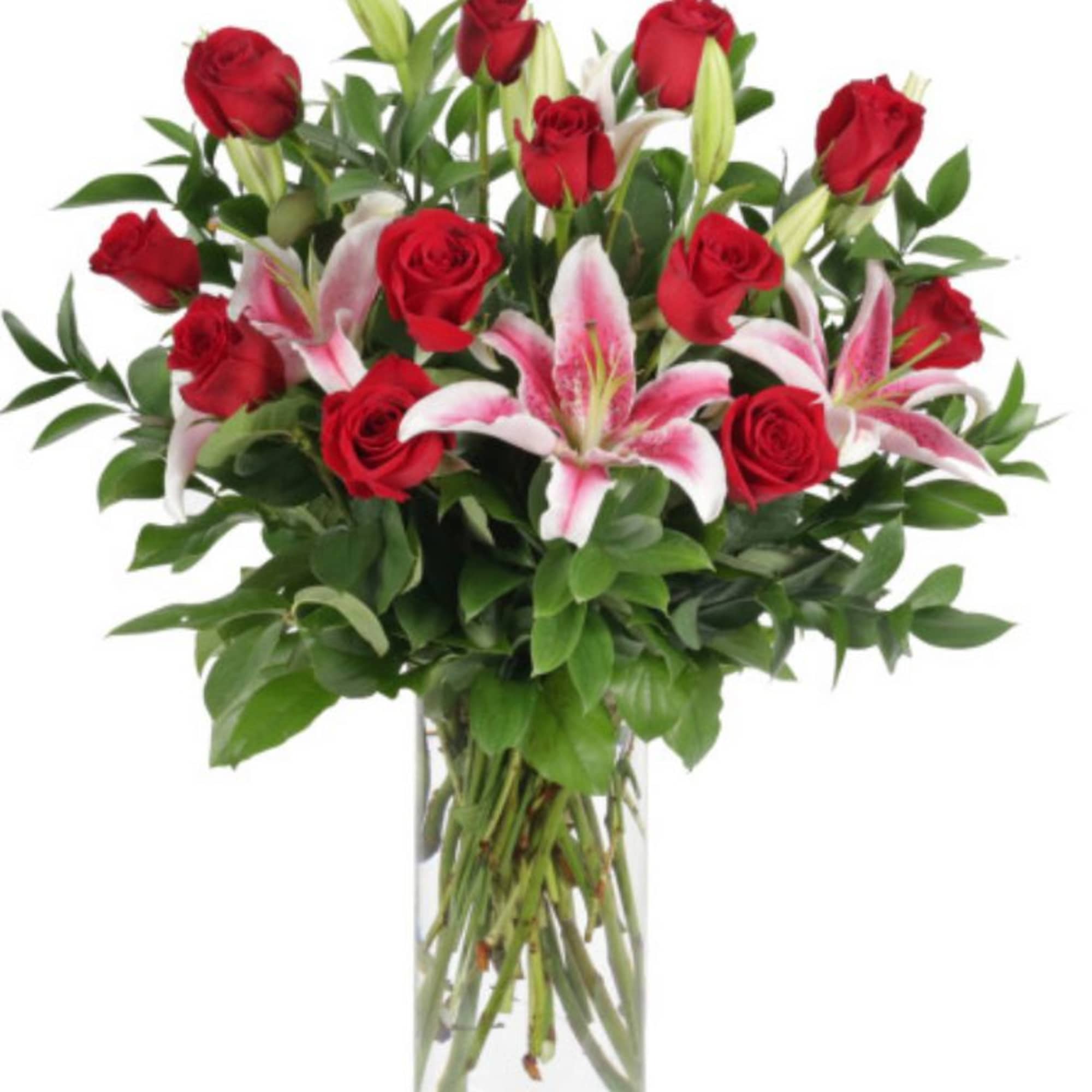Red roses and pink lilies in a clear glass vase