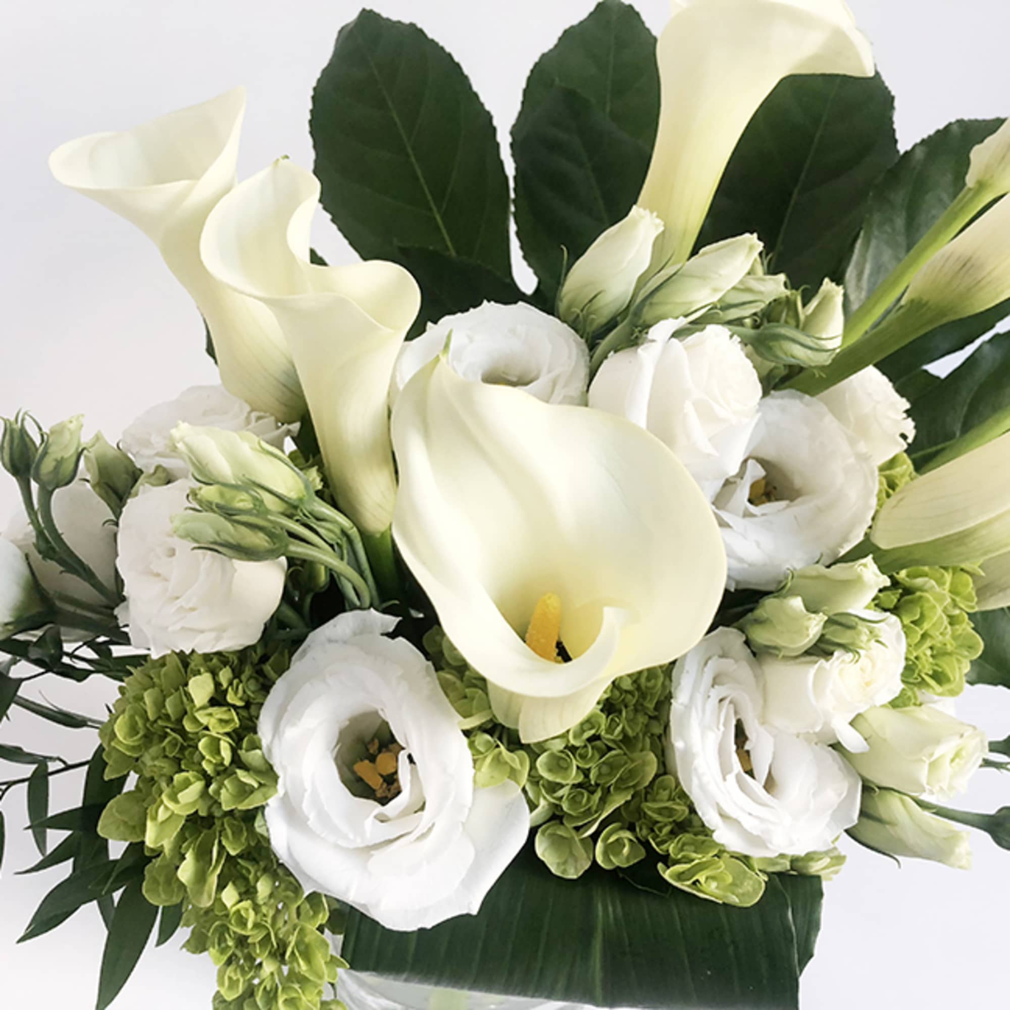 A very elegant design, featuring calla lily, white lisanthus and green hydrangea., photo 3 of 5