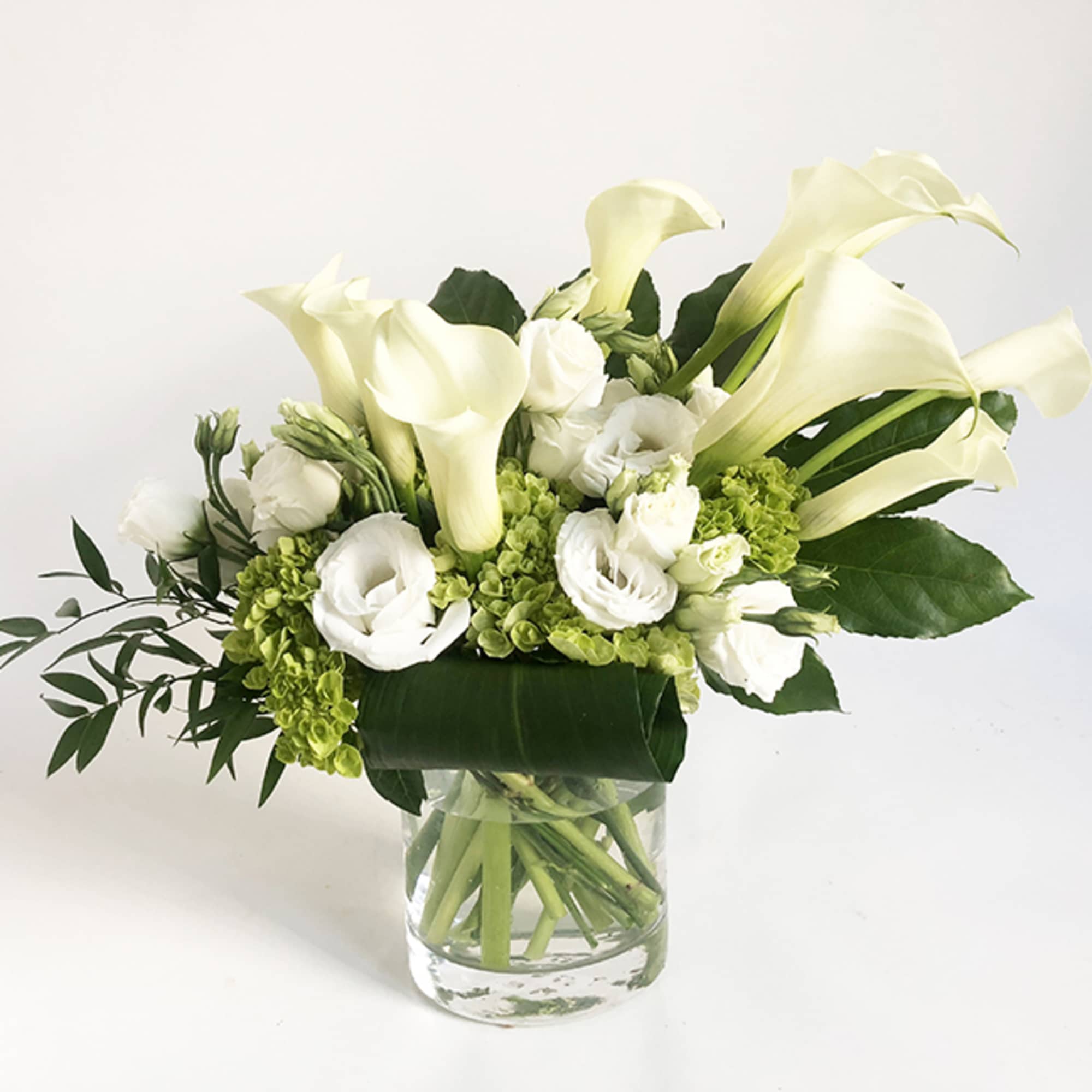 A very elegant design, featuring calla lily, white lisanthus and green hydrangea., photo 2 of 5