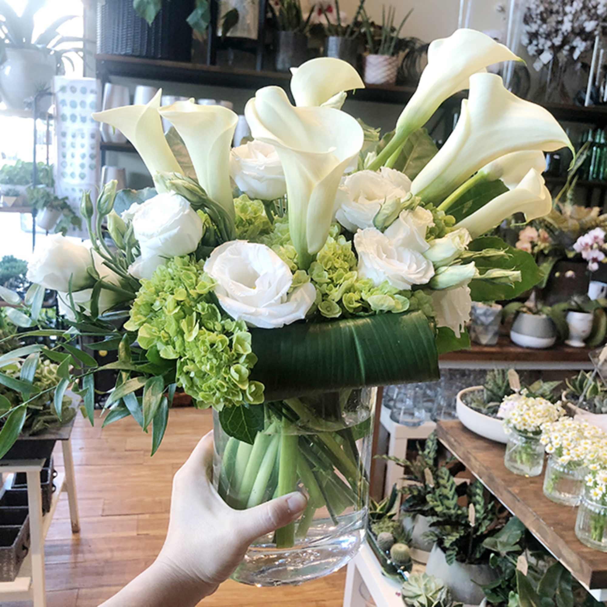 A very elegant design, featuring calla lily, white lisanthus and green hydrangea., photo 4 of 5