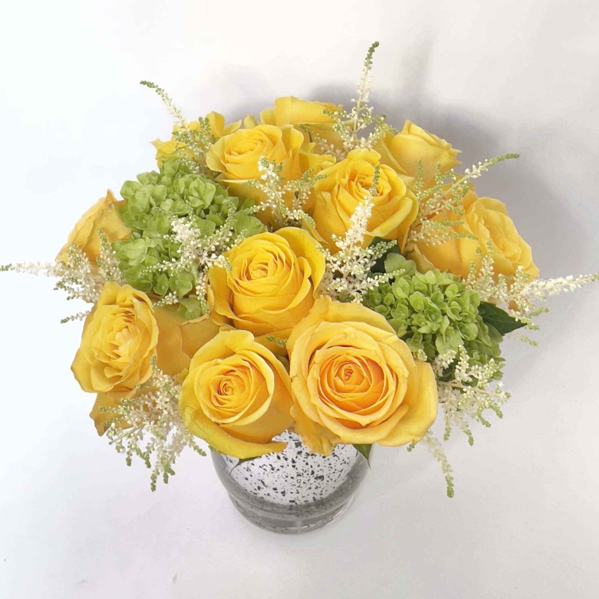 Simplicity is key. This elegant flower arrangement in a vase features the, photo 2 of 2