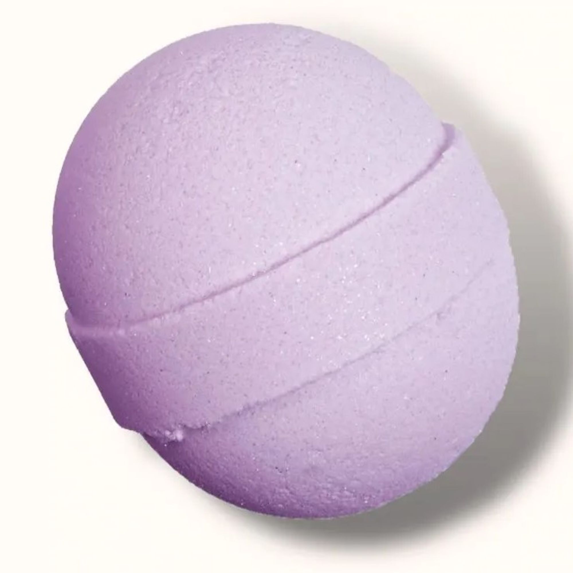 Lavender spherical bath bomb on a white background