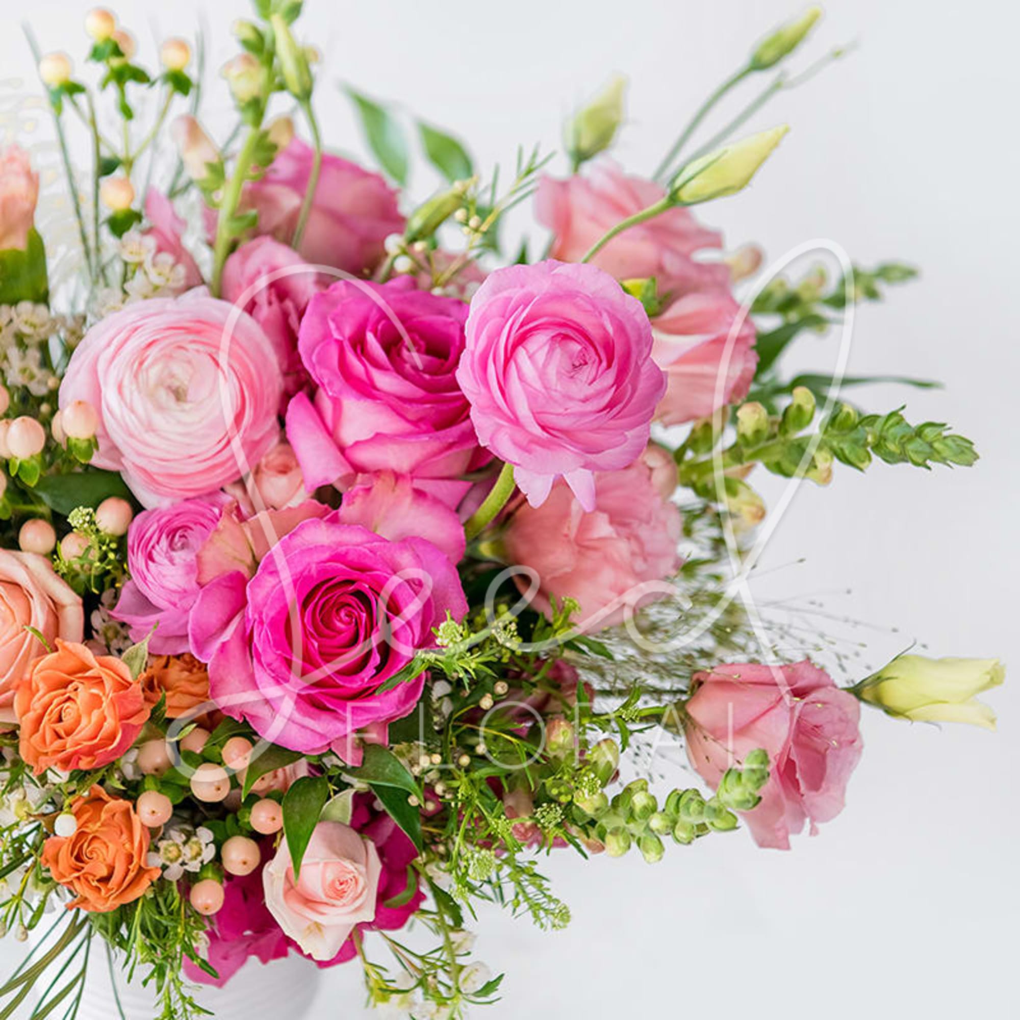 Pink and peach mixed bouquet with roses and ranunculus