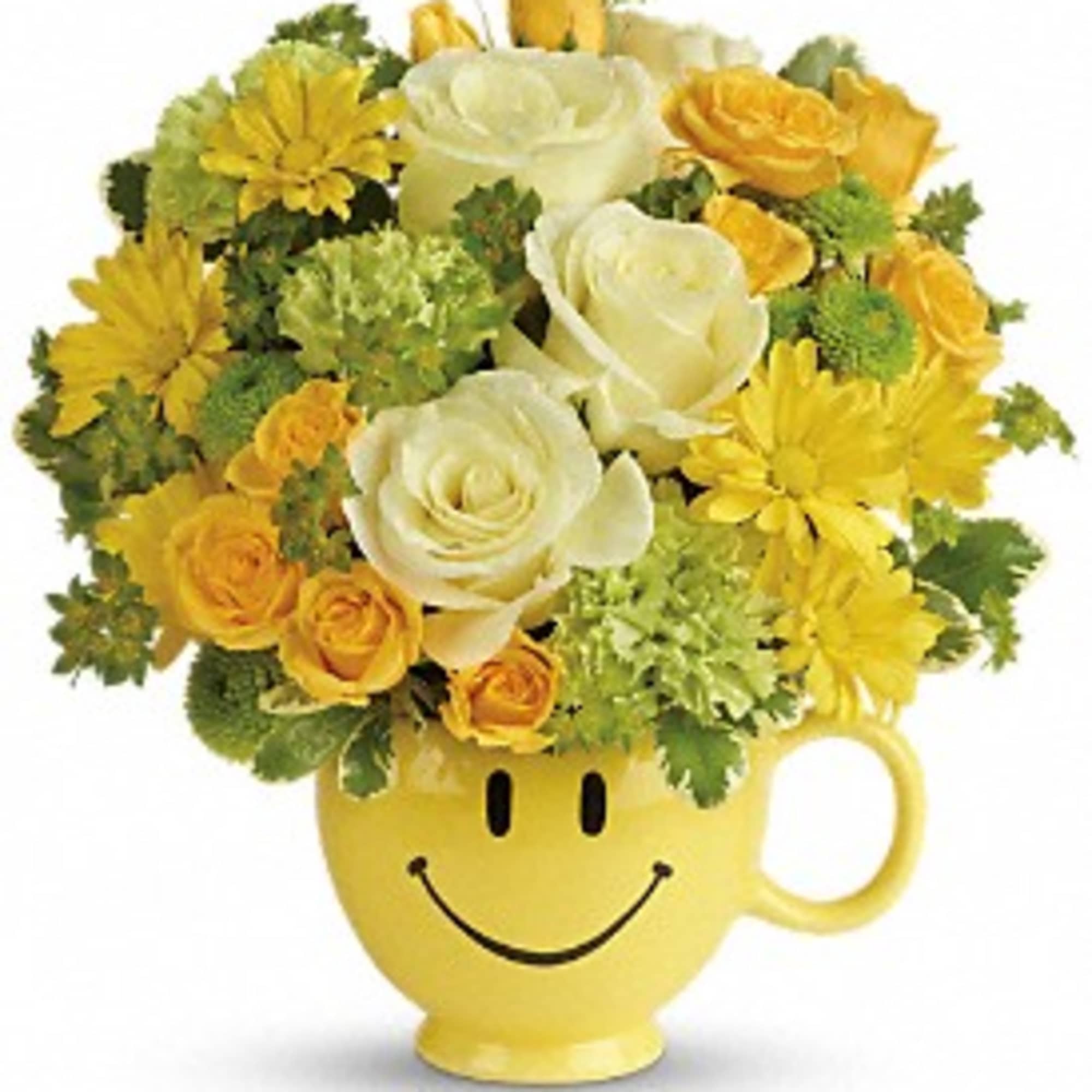 Yellow and white flower arrangement in a smiley-face mug