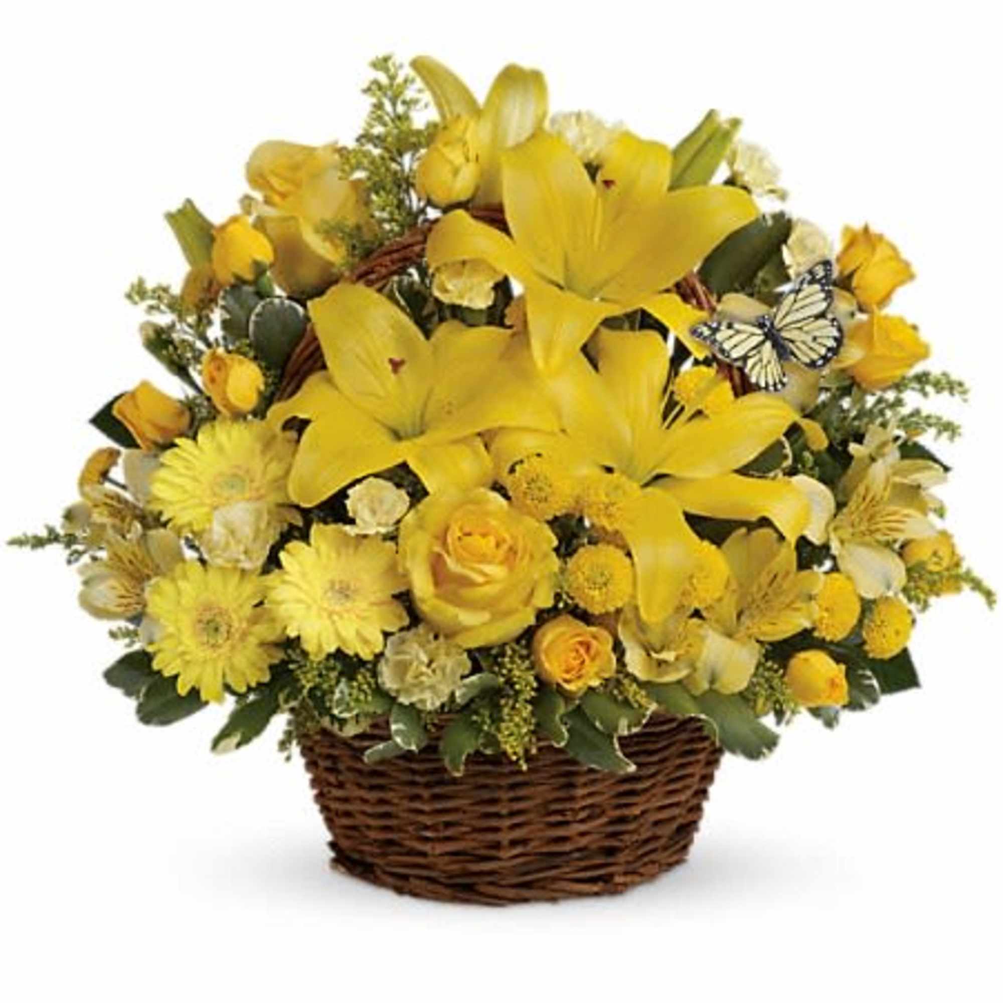 Yellow floral basket arrangement with lilies and roses in a wicker basket