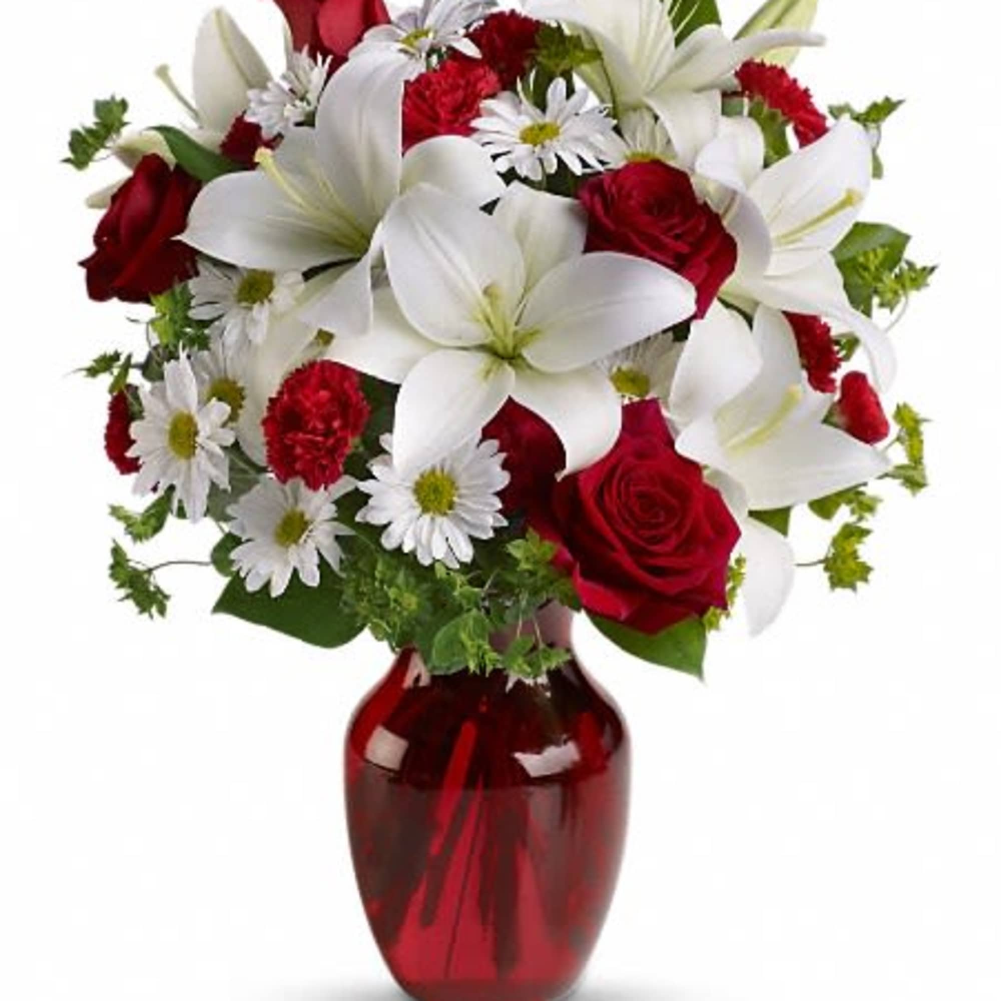 Red roses and white lilies in a red glass vase
