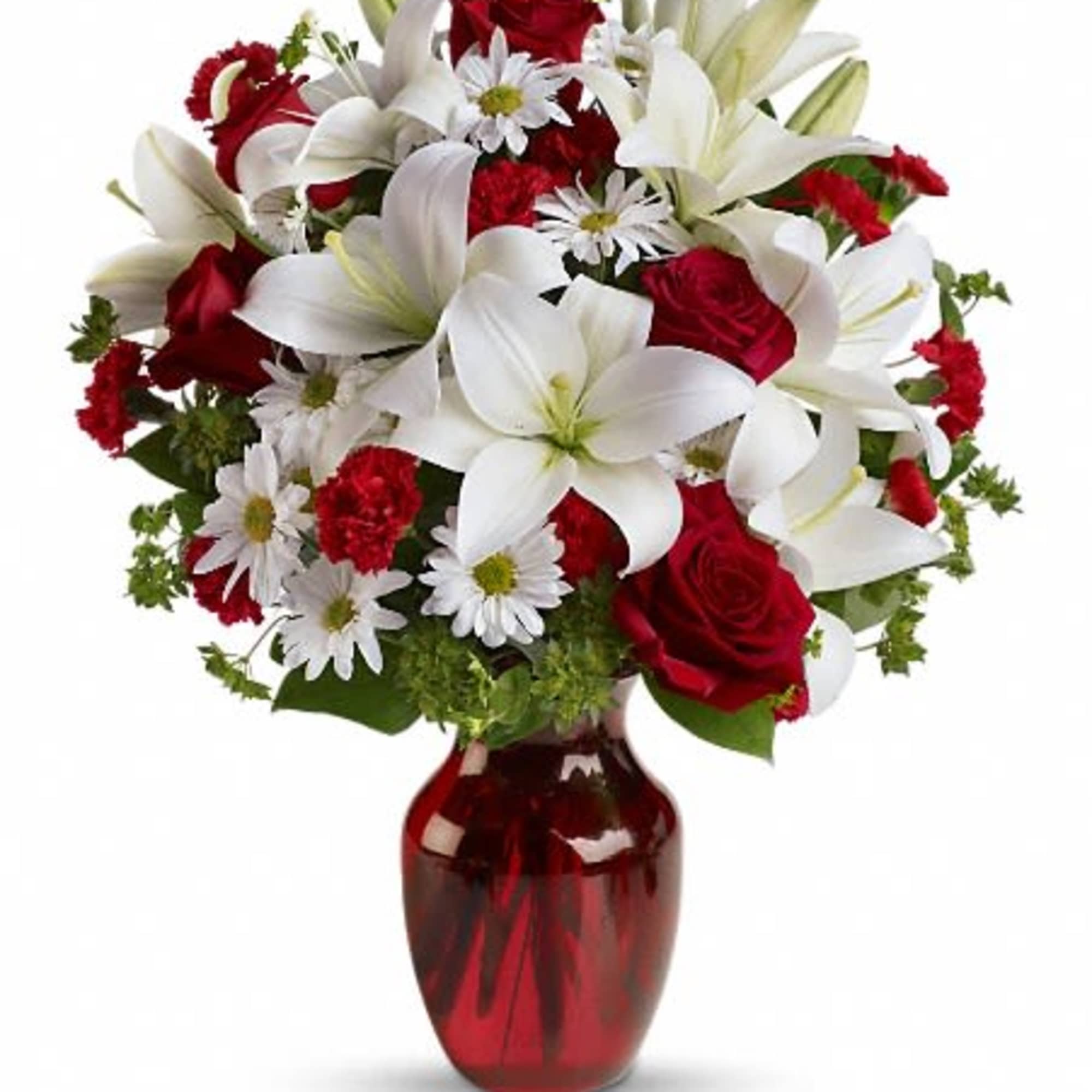 Red roses and white lilies in a red glass vase